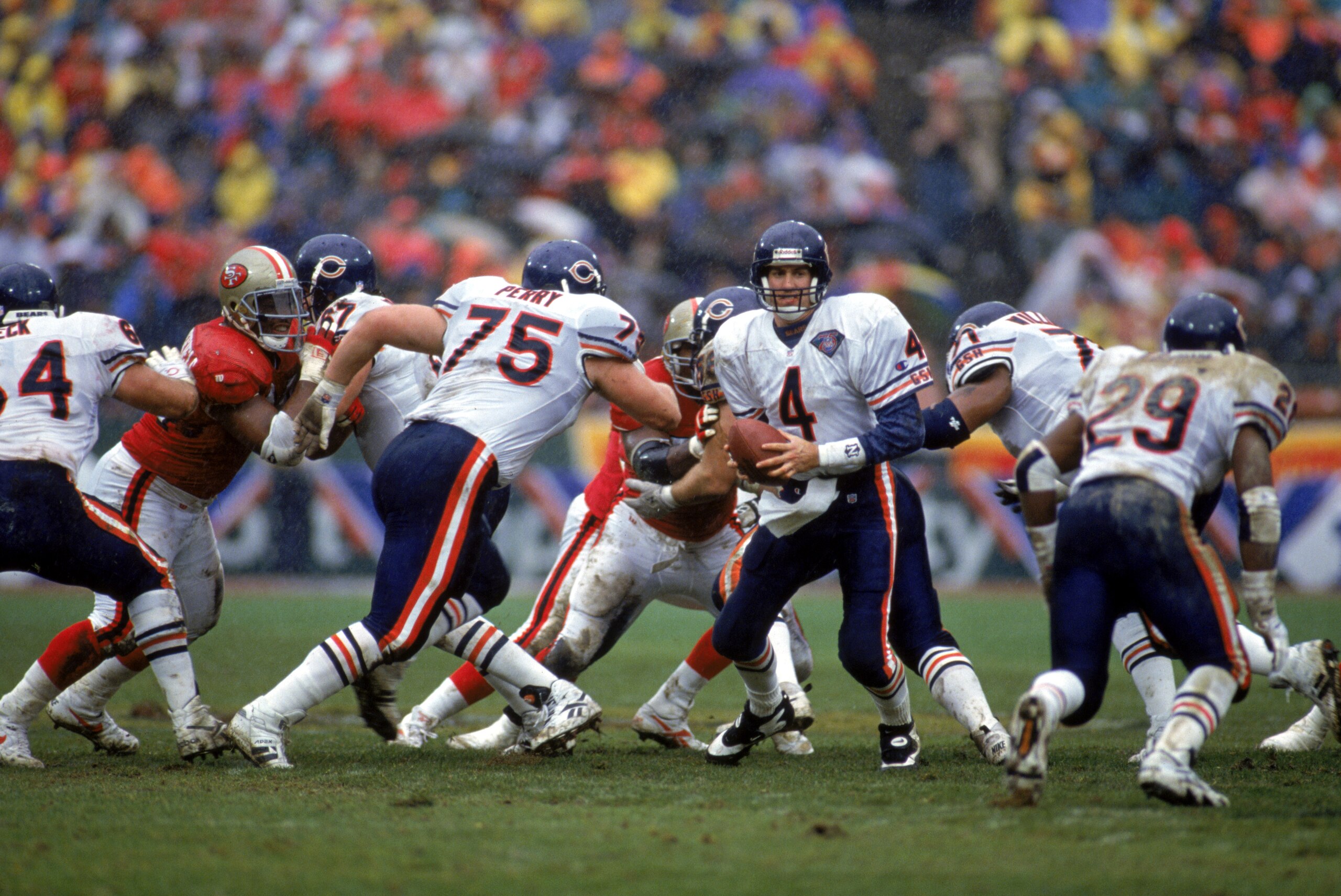 SAN FRANCISCO - JANUARY 7:  Quarterback Steve Walsh #4 of the Chicago Bears looks to hand off the ball during a 1994 NFC Divisional Playoff game against the San Francisco 49ers at Candlestick Park on January 7, 1995 in San Francisco, California.  The 49er