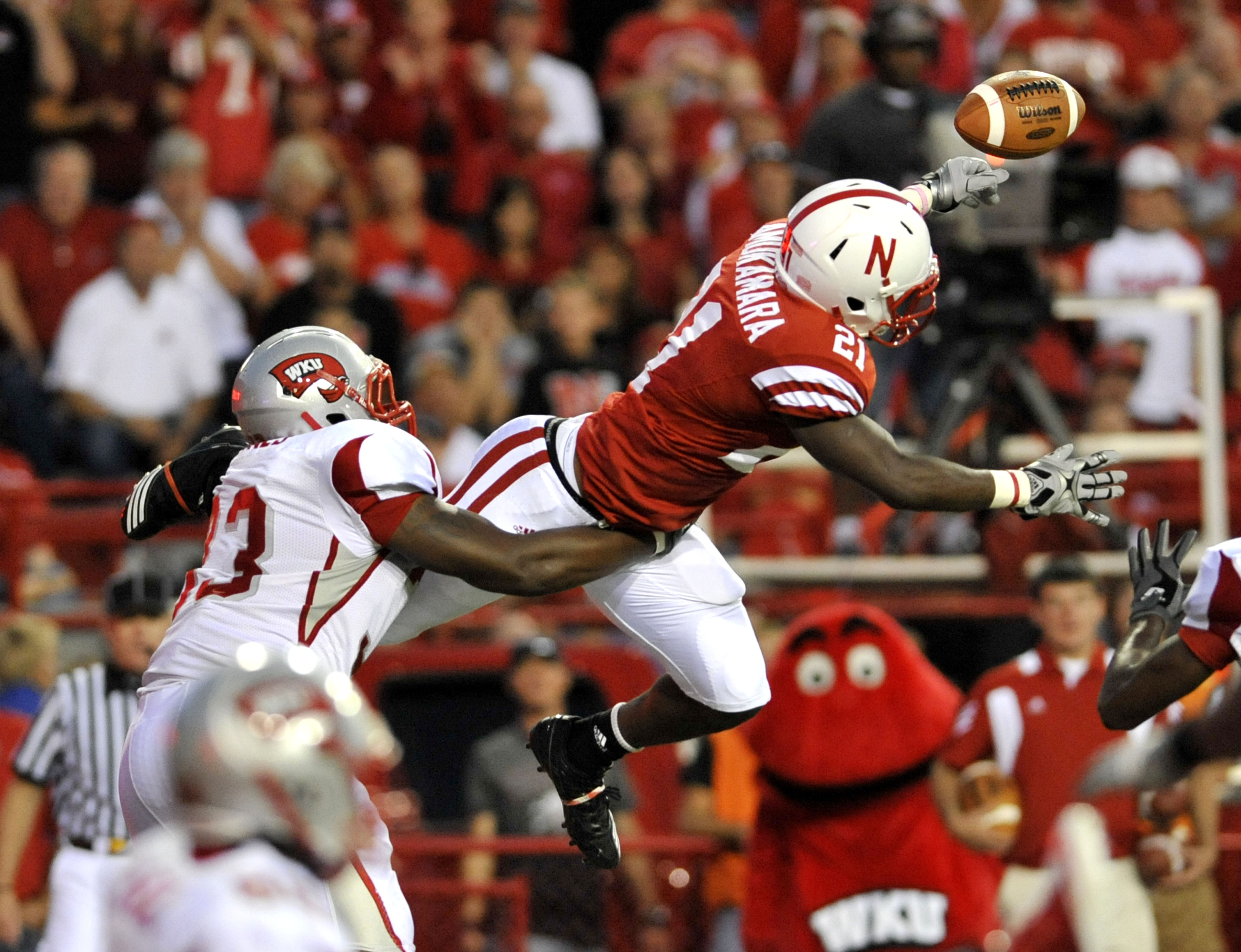 LINCOLN, NE - SEPTEMBER 04:  Prince Amukamara #21 of the Nebraska Cornhuskers knocks down a pass intended for Tristan Jones #33 of the Western Kentucky Hilltoppers during second half action of their game against at Memorial Stadium on September 4, 2010 in