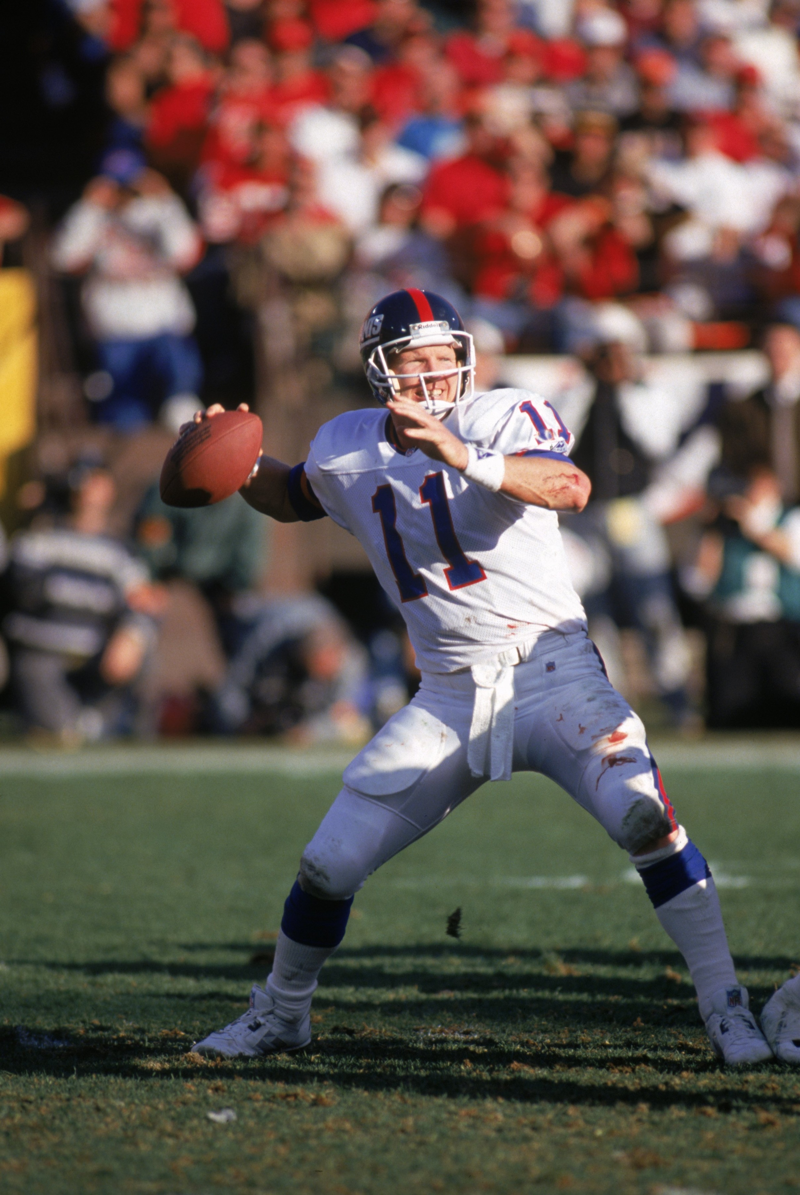 SAN FRANCISCO - JANUARY 15:  Quarterback Phil Simms #11 of the New York Giants passes during the 1993 NFC Divisional Playoff game against the San Francisco 49ers at Candlestick Park on January 15, 1994 in San Francisco, California.  The 49ers won 44-3.  (