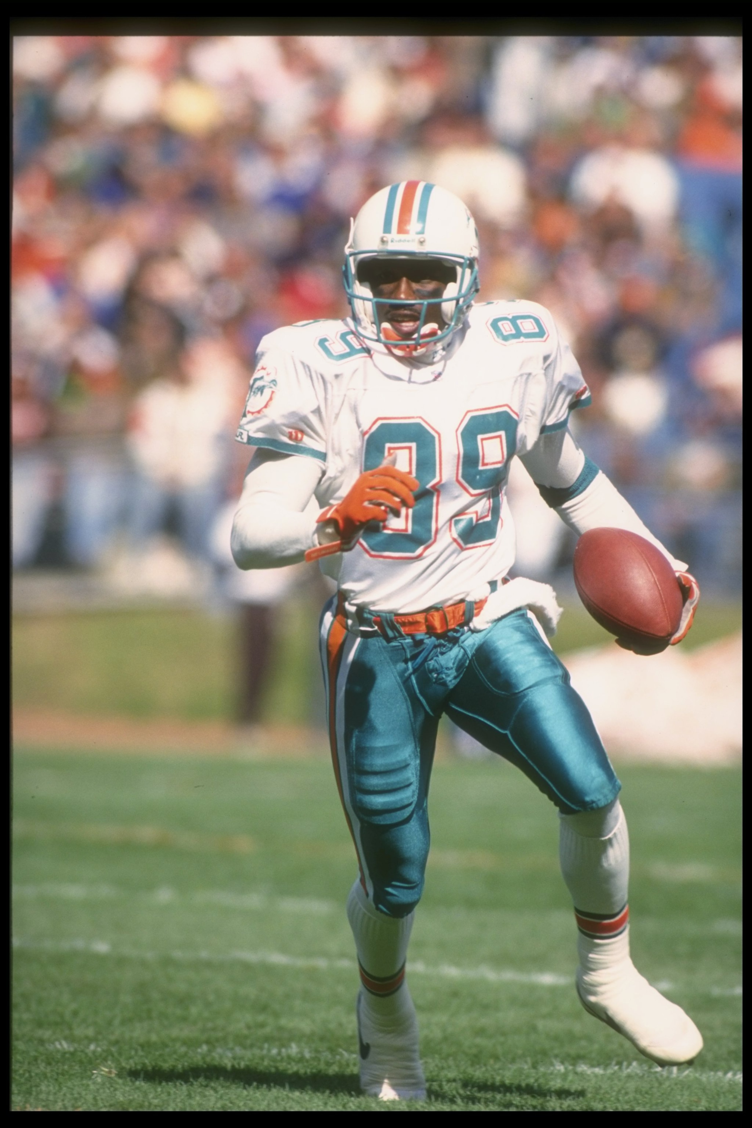 10 Oct 1993:  Wide receiver Tony Martin of the Miami Dolphins runs with the ball during a game against the Cleveland Browns at Cleveland Stadium in Cleveland, Ohio.  The Dolphins won the game, 24-14. Mandatory Credit: Jonathan Daniel  /Allsport