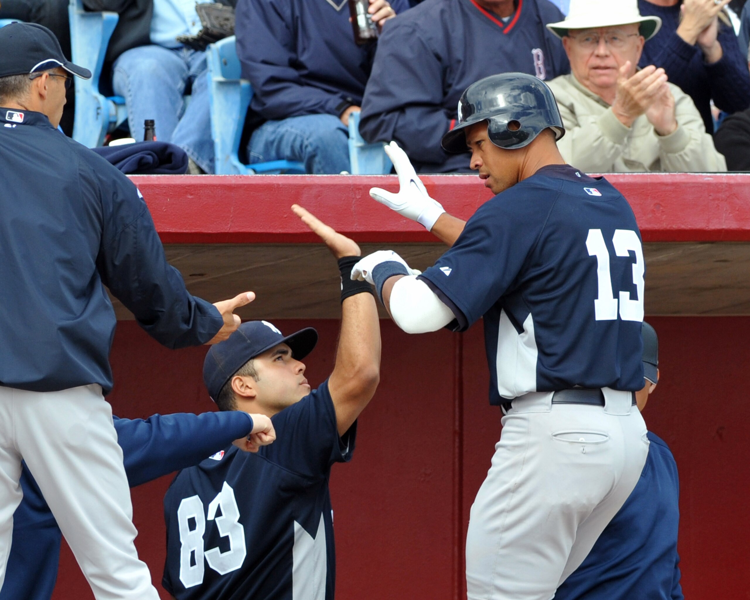 SARASOTA, FL - MARCH 1: Manager Joe Girardi (L) and catcher Jesus Montero #83 celebrate as infielder Alex Rodriguez #13 of the New York Yankees scores a run against the Cincinnati Reds March 1, 2009 at Ed Smith Stadium in Sarasota, Florida. (Photo by Al SARASOTA, FL - MARCH 1: Manager Joe Girardi (L) and catcher Jesus Montero #83 celebrate as infielder Alex Rodriguez #13 of the New York Yankees scores a run against the Cincinnati Reds March 1, 2009 at Ed Smith Stadium in Sarasota, Florida. (Photo by Al