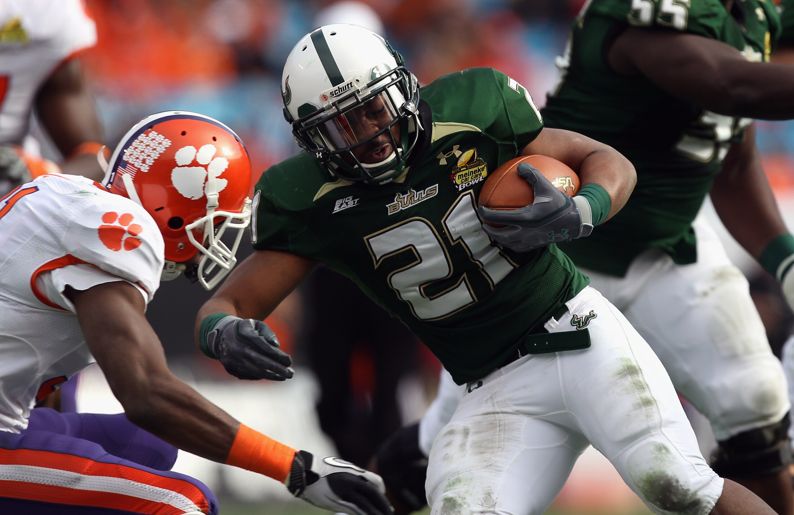 CHARLOTTE, NC - DECEMBER 31:  Demetris Murray #21 of the USF Bulls runs with the ball against the Clemson Tigers during their game at Bank of America Stadium on December 31, 2010 in Charlotte, North Carolina.  (Photo by Streeter Lecka/Getty Images)