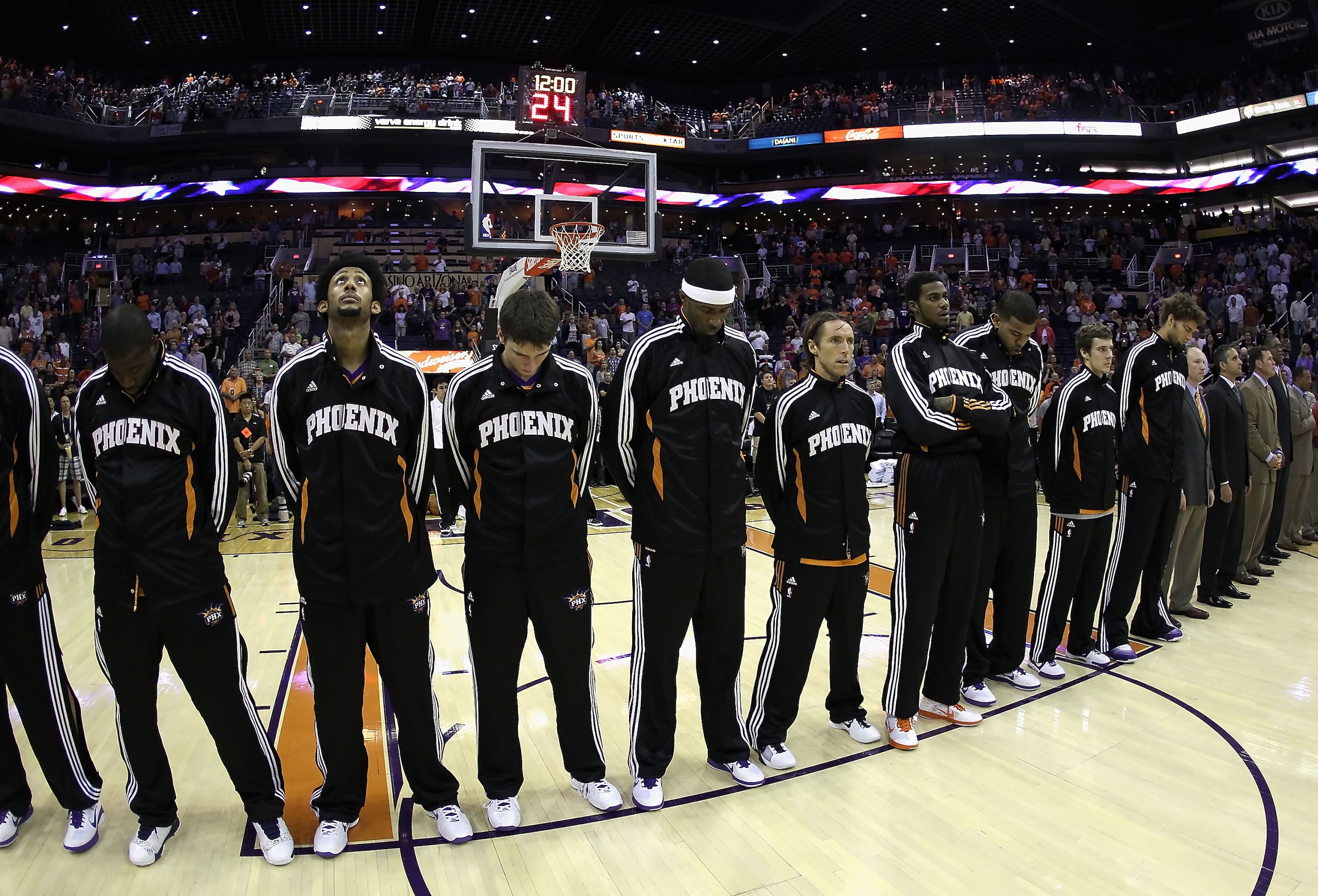 PHOENIX - OCTOBER 19:  The Phoenix Suns line up for the National Anthem during the preseason NBA game against the Golden State Warriors at US Airways Center on October 19, 2010 in Phoenix, Arizona. NOTE TO USER: User expressly acknowledges and agrees that