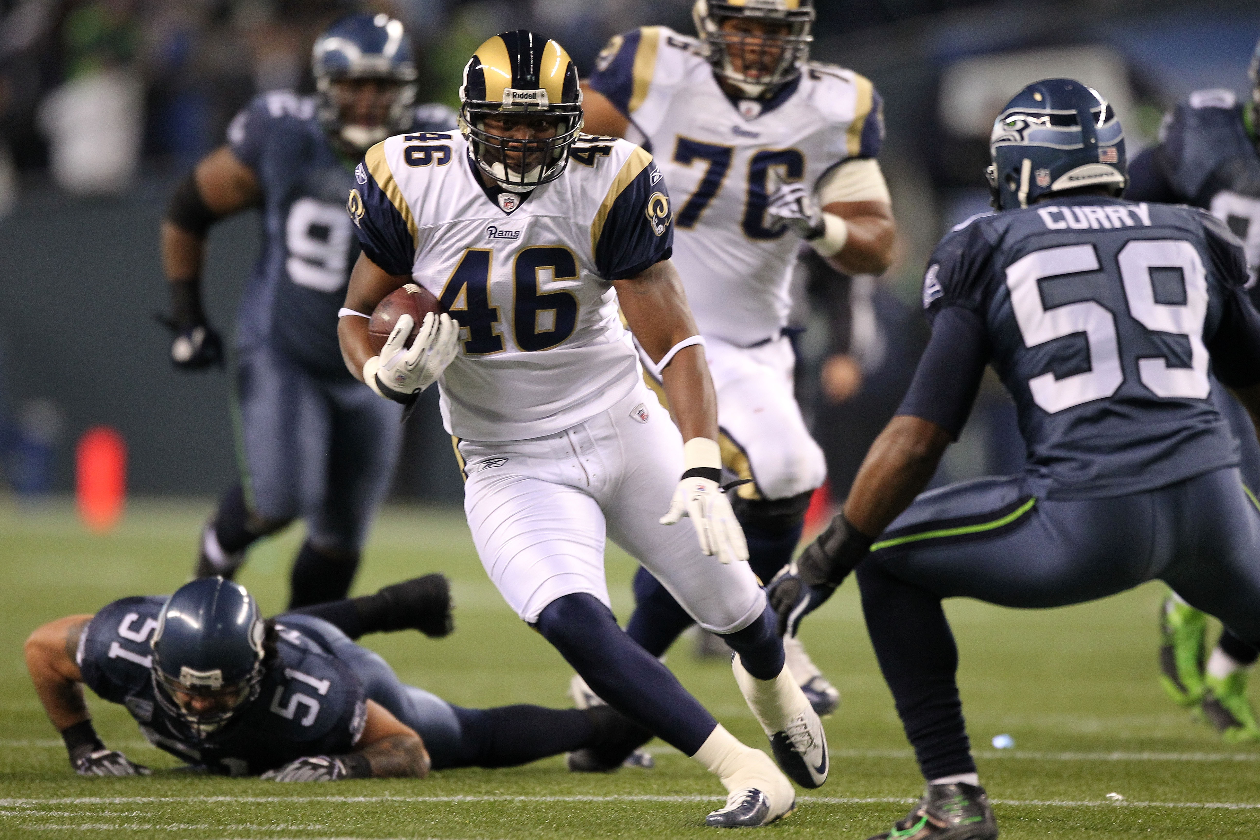SEATTLE, WA - JANUARY 02:  Tight end Daniel Fells #46 of the St. Louis Rams runs with the ball after a catch against the Seattle Seahawks during their game at Qwest Field on January 2, 2011 in Seattle, Washington.  (Photo by Otto Greule Jr/Getty Images)