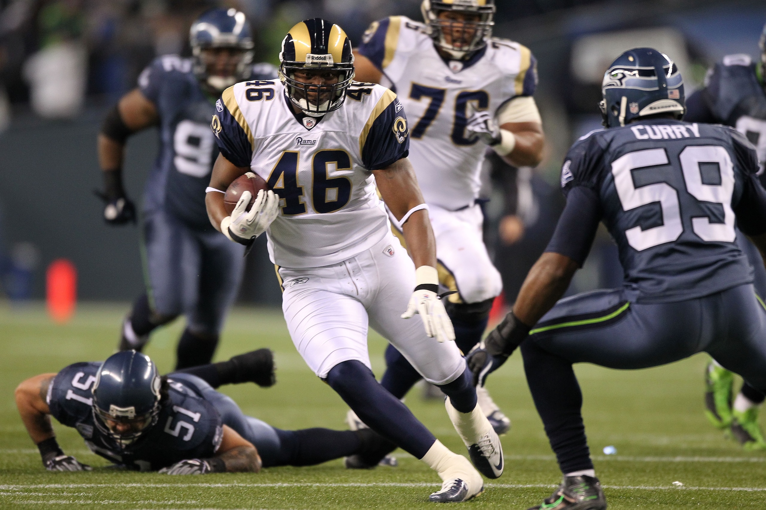 SEATTLE, WA - JANUARY 02:  Tight end Daniel Fells #46 of the St. Louis Rams runs with the ball after a catch against the Seattle Seahawks during their game at Qwest Field on January 2, 2011 in Seattle, Washington.  (Photo by Otto Greule Jr/Getty Images)