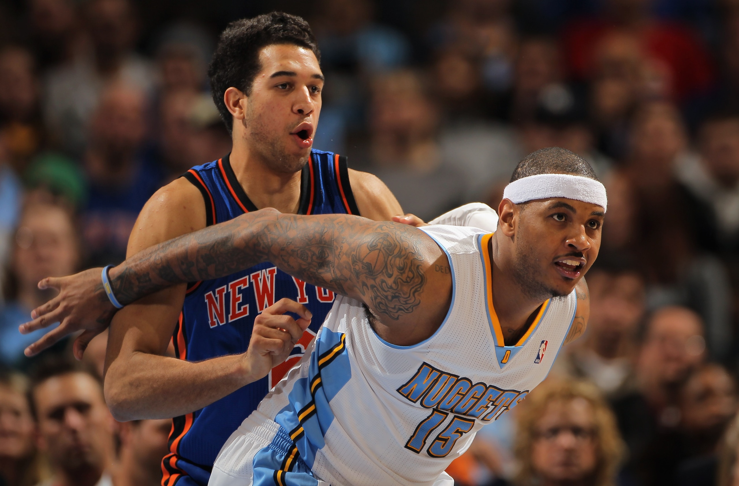 DENVER - NOVEMBER 16: Carmelo Anthony #15 of the Denver Nuggets fights for position with Landry Fields #6 of the New York Knicks at the Pepsi Center on November 16, 2010 in Denver, Colorado. NOTE TO USER: User expressly acknowledges and agrees that, by d DENVER - NOVEMBER 16: Carmelo Anthony #15 of the Denver Nuggets fights for position with Landry Fields #6 of the New York Knicks at the Pepsi Center on November 16, 2010 in Denver, Colorado. NOTE TO USER: User expressly acknowledges and agrees that, by d