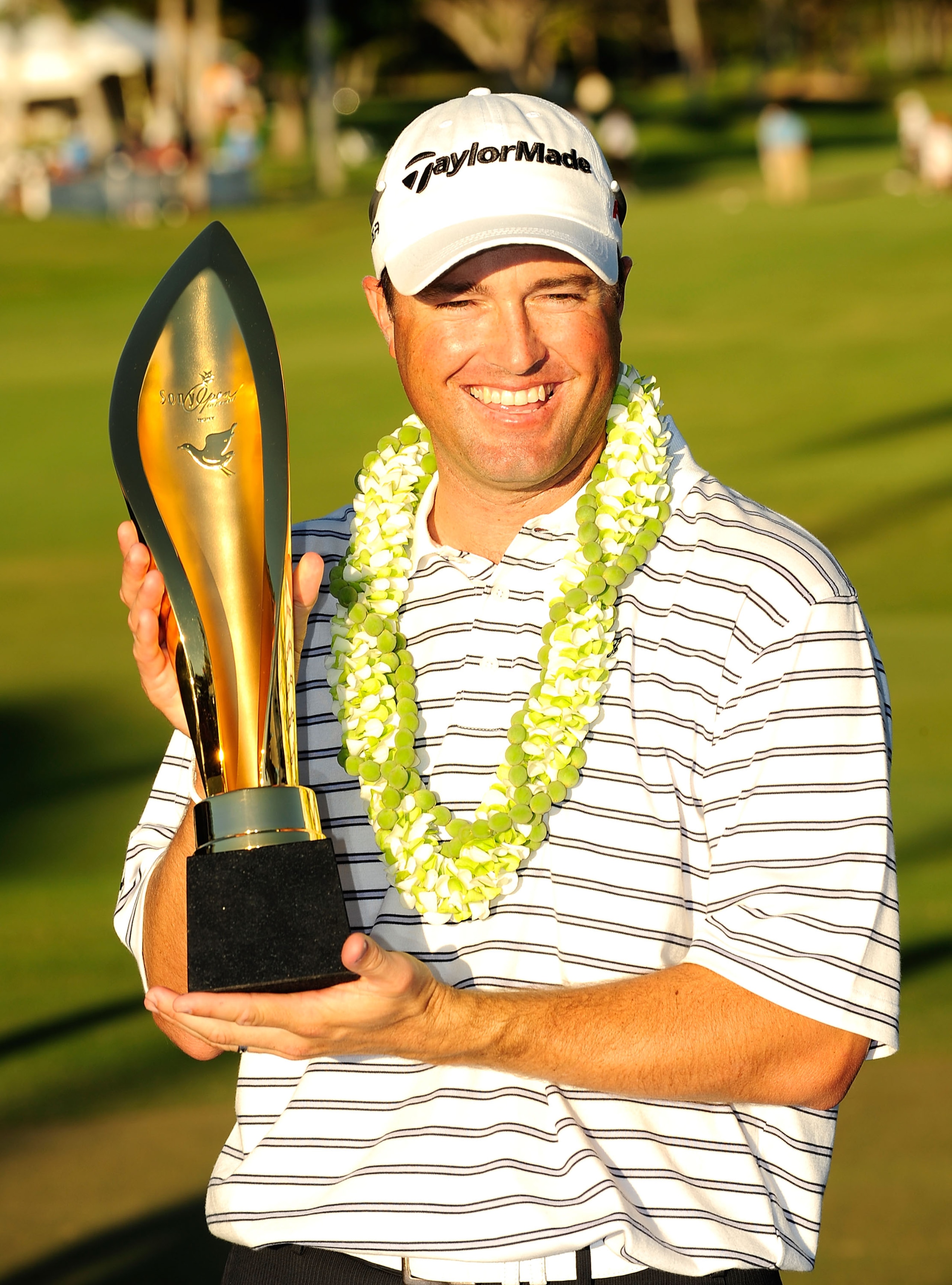 HONOLULU - JANUARY 17:  Ryan Palmer poses with the trophy after winning the Sony Open at Waialae Country Club on January 17, 2010 in Honolulu, Hawaii.  (Photo by Sam Greenwood/Getty Images)