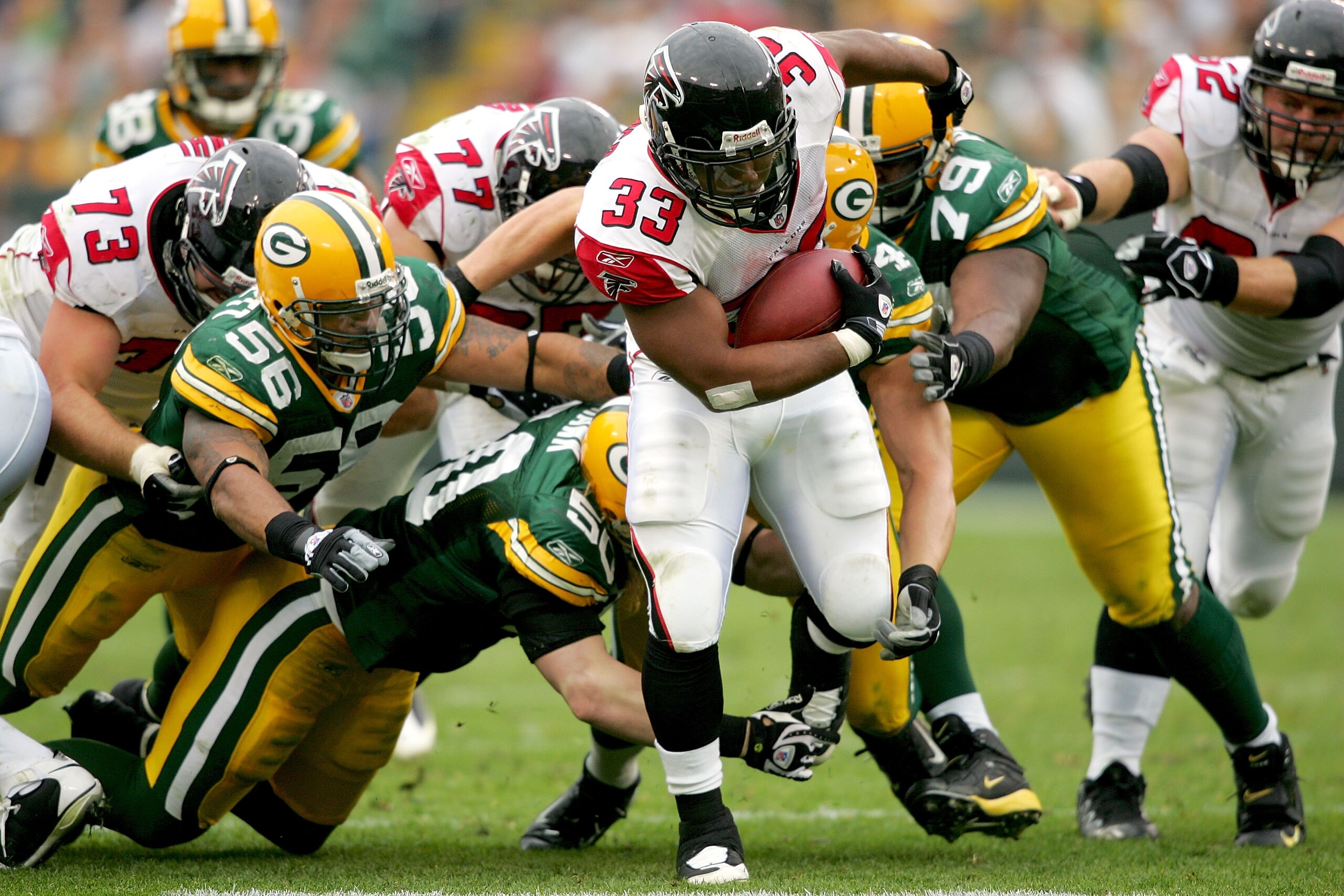 GREEN BAY, WI - OCTOBER 05:  Michael Turner #33 of the Atlanta Falcons carries the ball against the Green Bay Packers at Lambeu Field October 5, 2008 in Green Bay, Wisconsin.  (Photo by Matthew Stockman/Getty Images)
