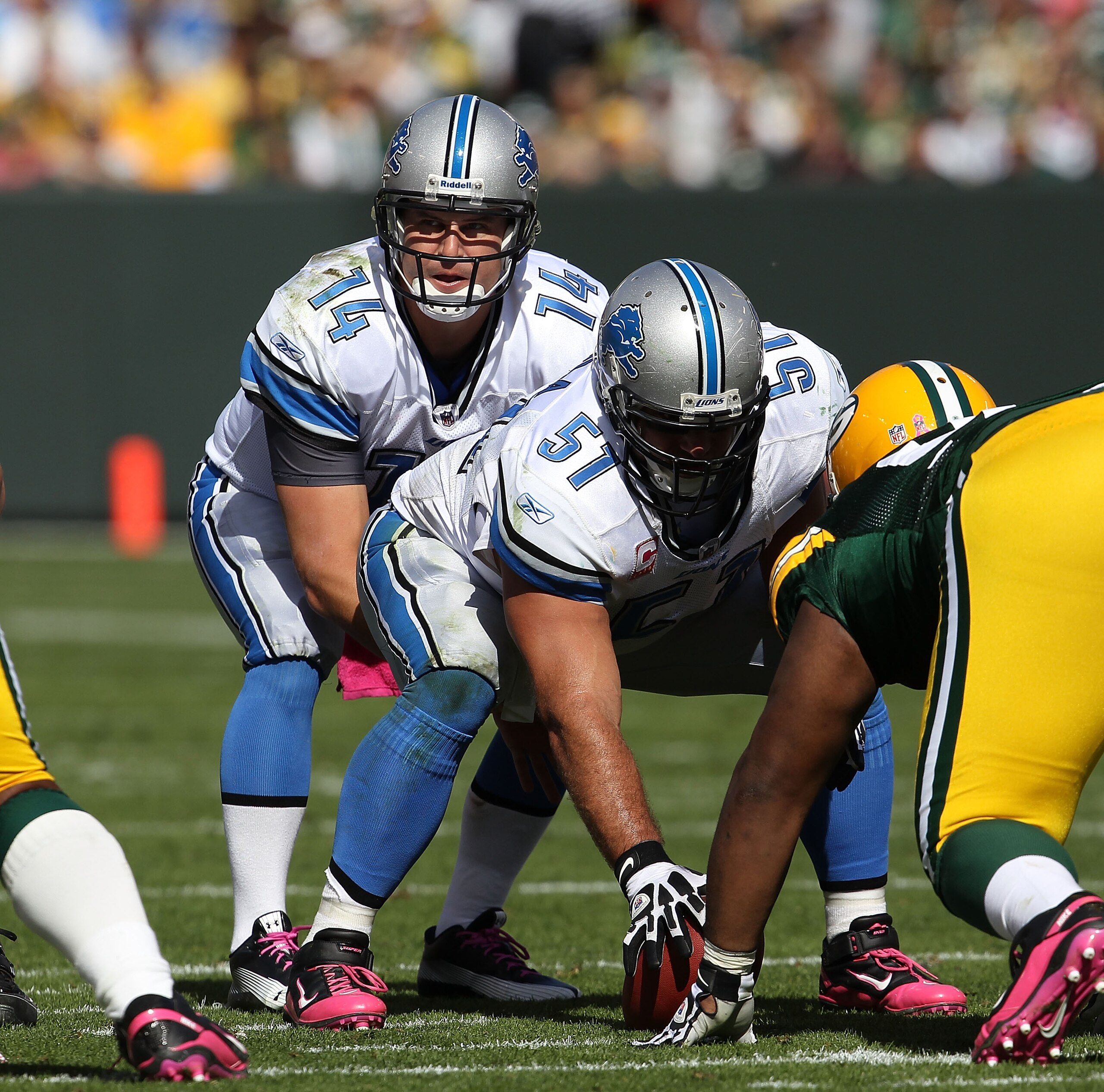 GREEN BAY, WI - OCTOBER 03: Shaun Hill #14 of the Detroit Lions calls the signals as Dominic Raiola #51 waits to snap the ball against the Green Bay Packers at Lambeau Field on October 3, 2010 in Green Bay, Wisconsin. The Packers defeated the Lions 28-26. GREEN BAY, WI - OCTOBER 03: Shaun Hill #14 of the Detroit Lions calls the signals as Dominic Raiola #51 waits to snap the ball against the Green Bay Packers at Lambeau Field on October 3, 2010 in Green Bay, Wisconsin. The Packers defeated the Lions 28-26.