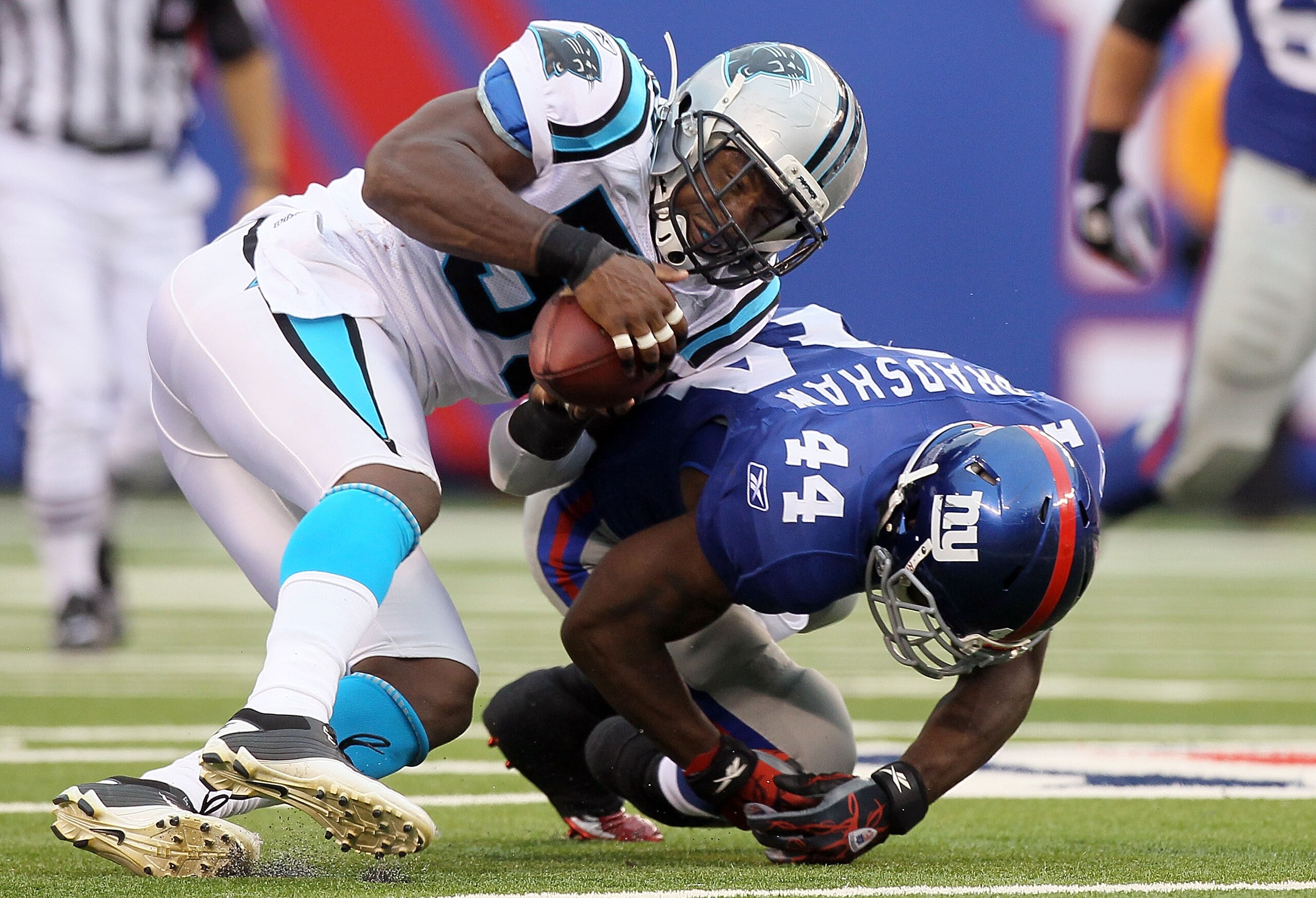 EAST RUTHERFORD, NJ - SEPTEMBER 12: James Anderson #50 of the Carolina Panthers intercepts a pass intended for Ahmad Bradshaw #44 of the New York Giants on September 12, 2010 at the New Meadowlands Stadium in East Rutherford, New Jersey. (Photo by Jim M EAST RUTHERFORD, NJ - SEPTEMBER 12: James Anderson #50 of the Carolina Panthers intercepts a pass intended for Ahmad Bradshaw #44 of the New York Giants on September 12, 2010 at the New Meadowlands Stadium in East Rutherford, New Jersey. (Photo by Jim M