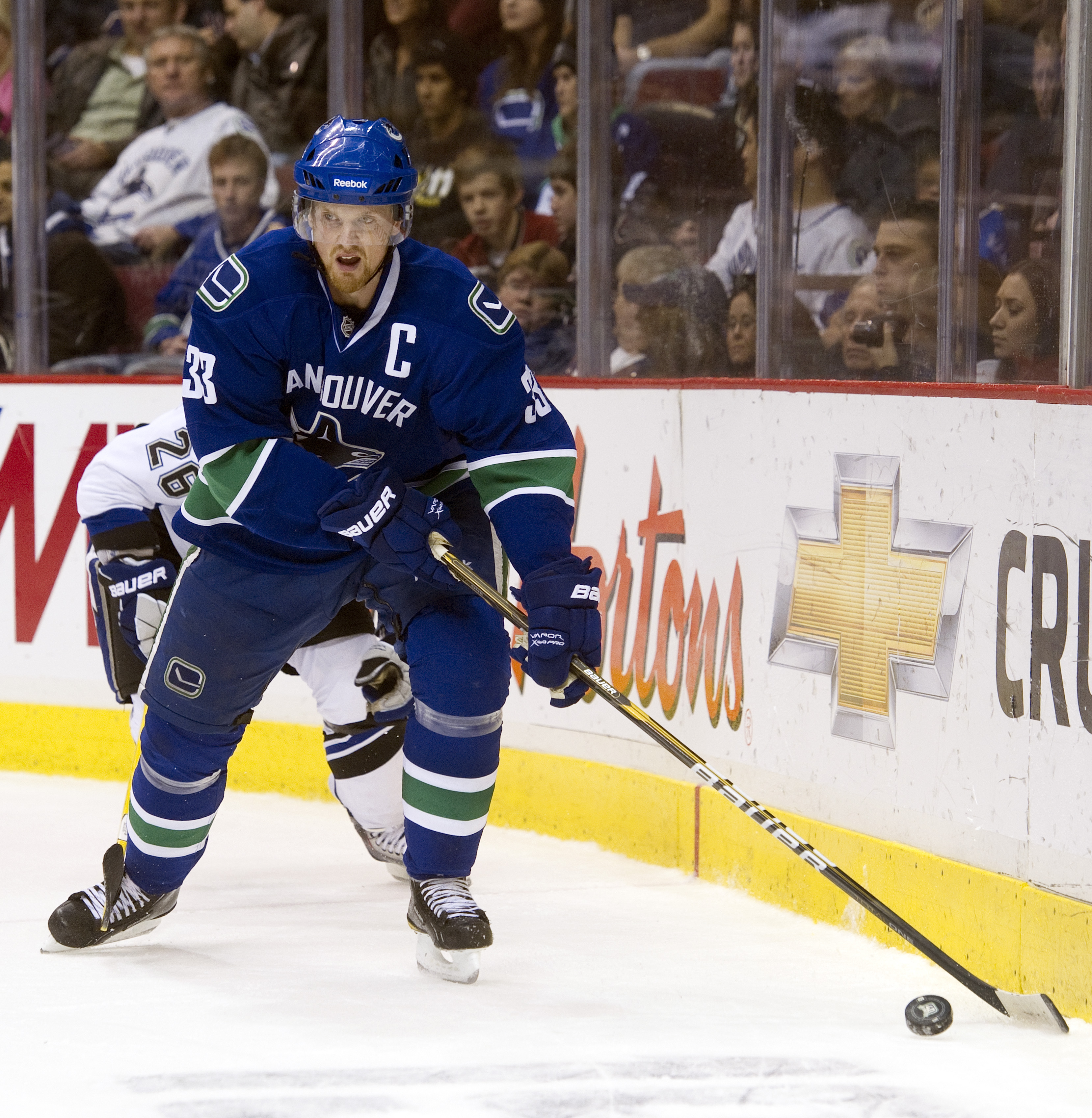 VANCOUVER, CANADA - DECEMBER 11: Henrik Sedin #33 of the Vancouver Canucks skates with the puck during NHL action on December 11, 2010 against the Tampa Bay Lightning at Rogers Arena in Vancouver, BC, Canada.  (Photo by Rich Lam/Getty Images)
