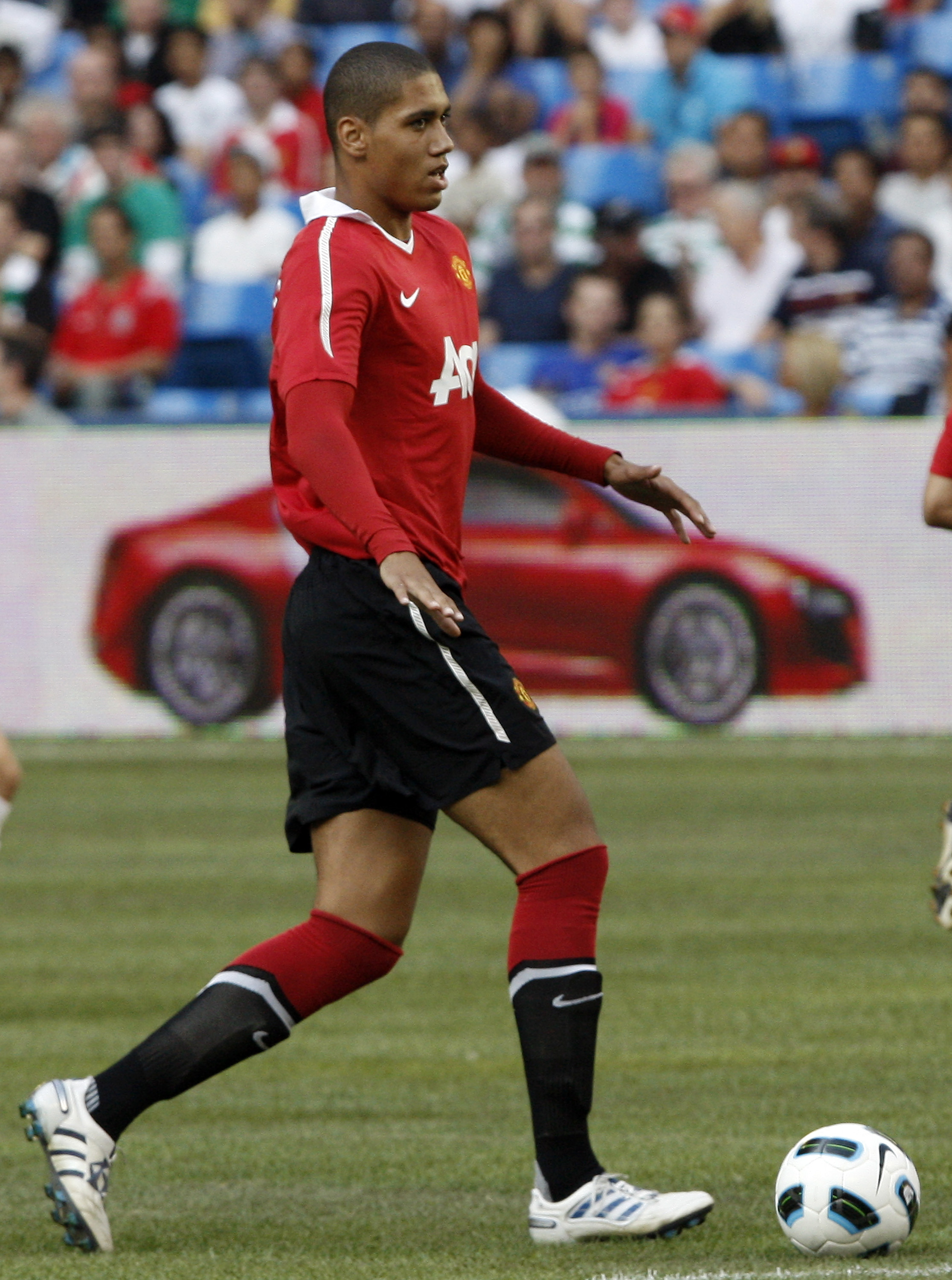 TORONTO - JULY 16: Chris Smalling #12 of Manchester United carries the ball against of Celtic F.C. during a friendly match at the Rogers Centre July 16, 2010 in Toronto, Ontario, Canada. Manchester United won 3-1.  (Photo by Abelimages/Getty Images)