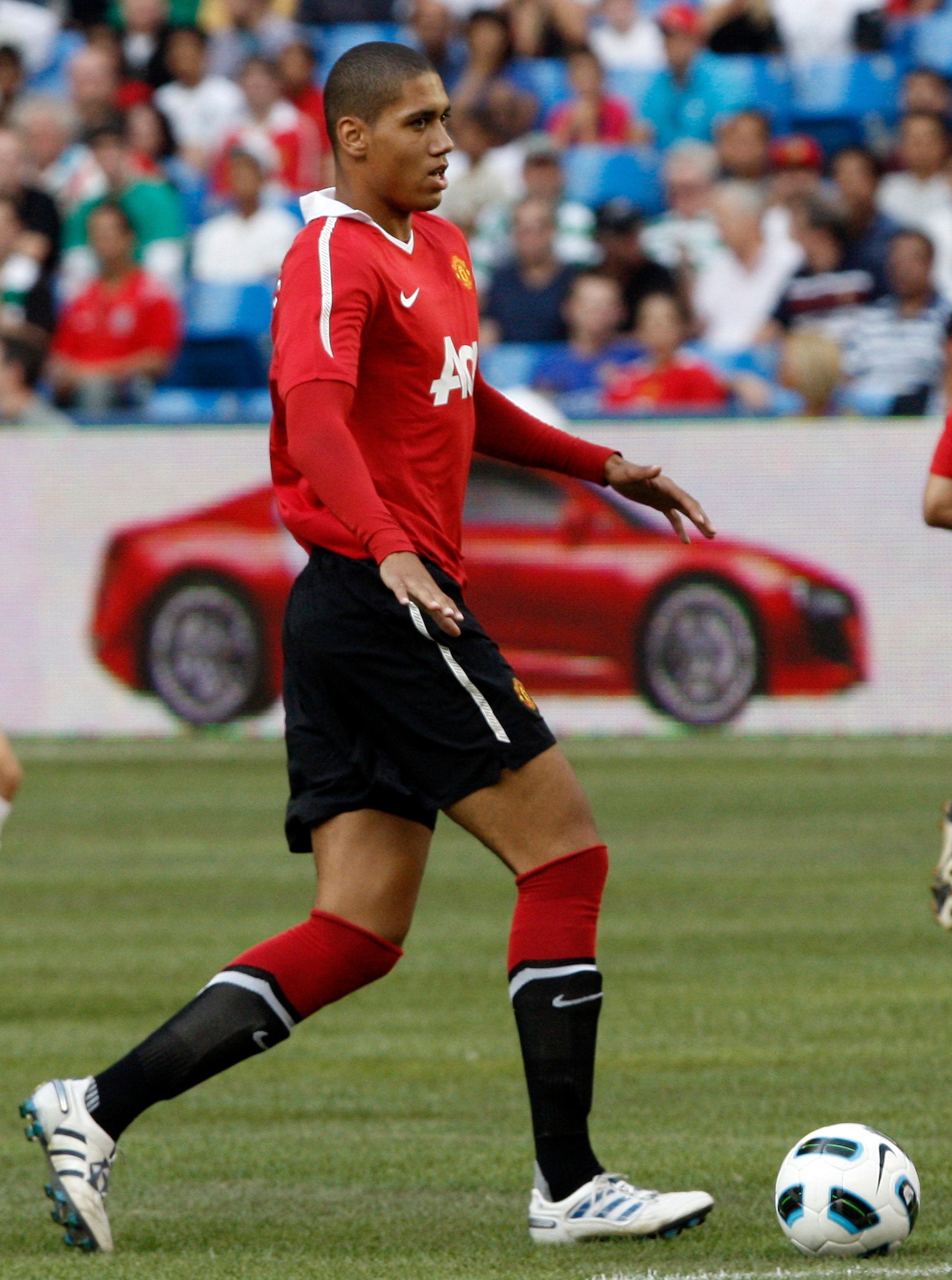 TORONTO - JULY 16: Chris Smalling #12 of Manchester United carries the ball against of Celtic F.C. during a friendly match at the Rogers Centre July 16, 2010 in Toronto, Ontario, Canada. Manchester United won 3-1.  (Photo by Abelimages/Getty Images)
