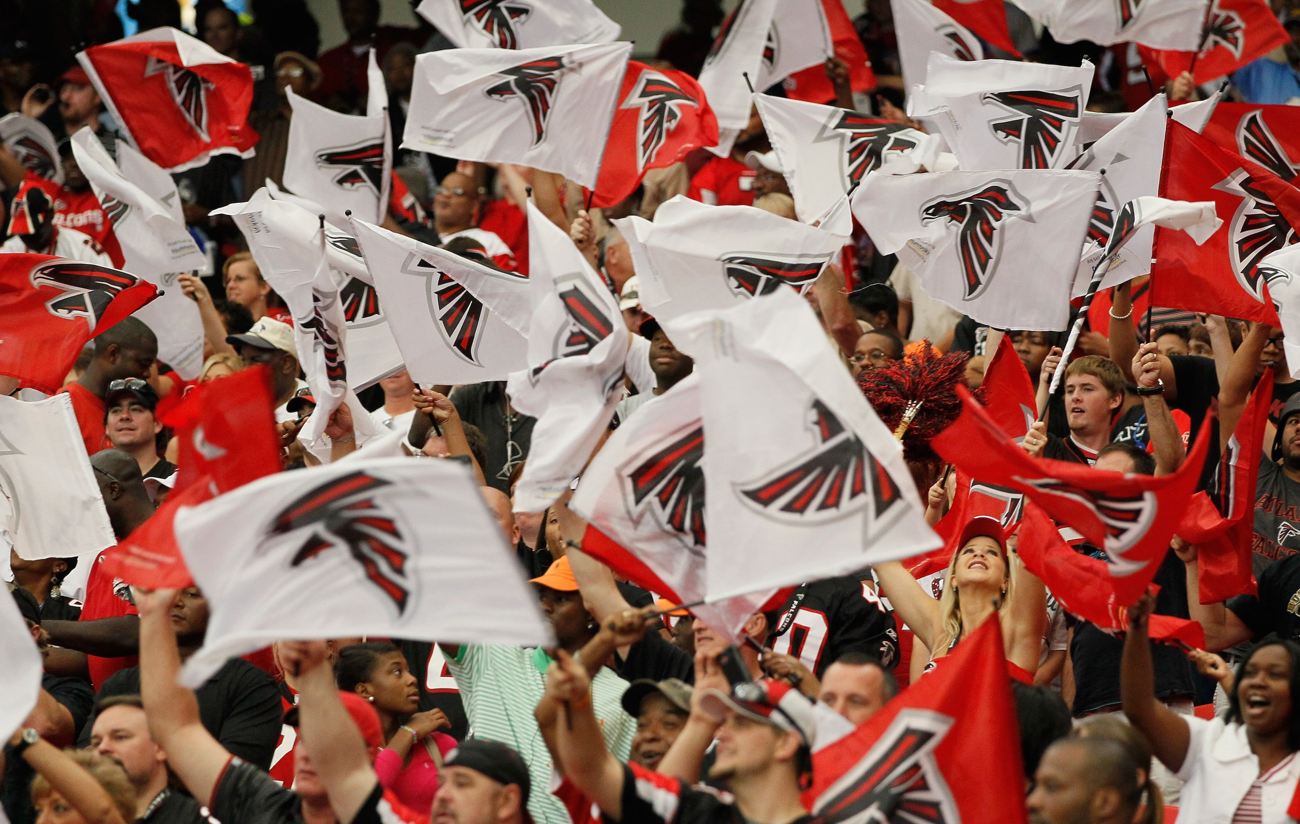 ATLANTA - SEPTEMBER 19: Fans of the Atlanta Falcons wave flags during the game against the Arizona Cardinals at Georgia Dome on September 19, 2010 in Atlanta, Georgia. (Photo by Kevin C. Cox/Getty Images) ATLANTA - SEPTEMBER 19: Fans of the Atlanta Falcons wave flags during the game against the Arizona Cardinals at Georgia Dome on September 19, 2010 in Atlanta, Georgia. (Photo by Kevin C. Cox/Getty Images)