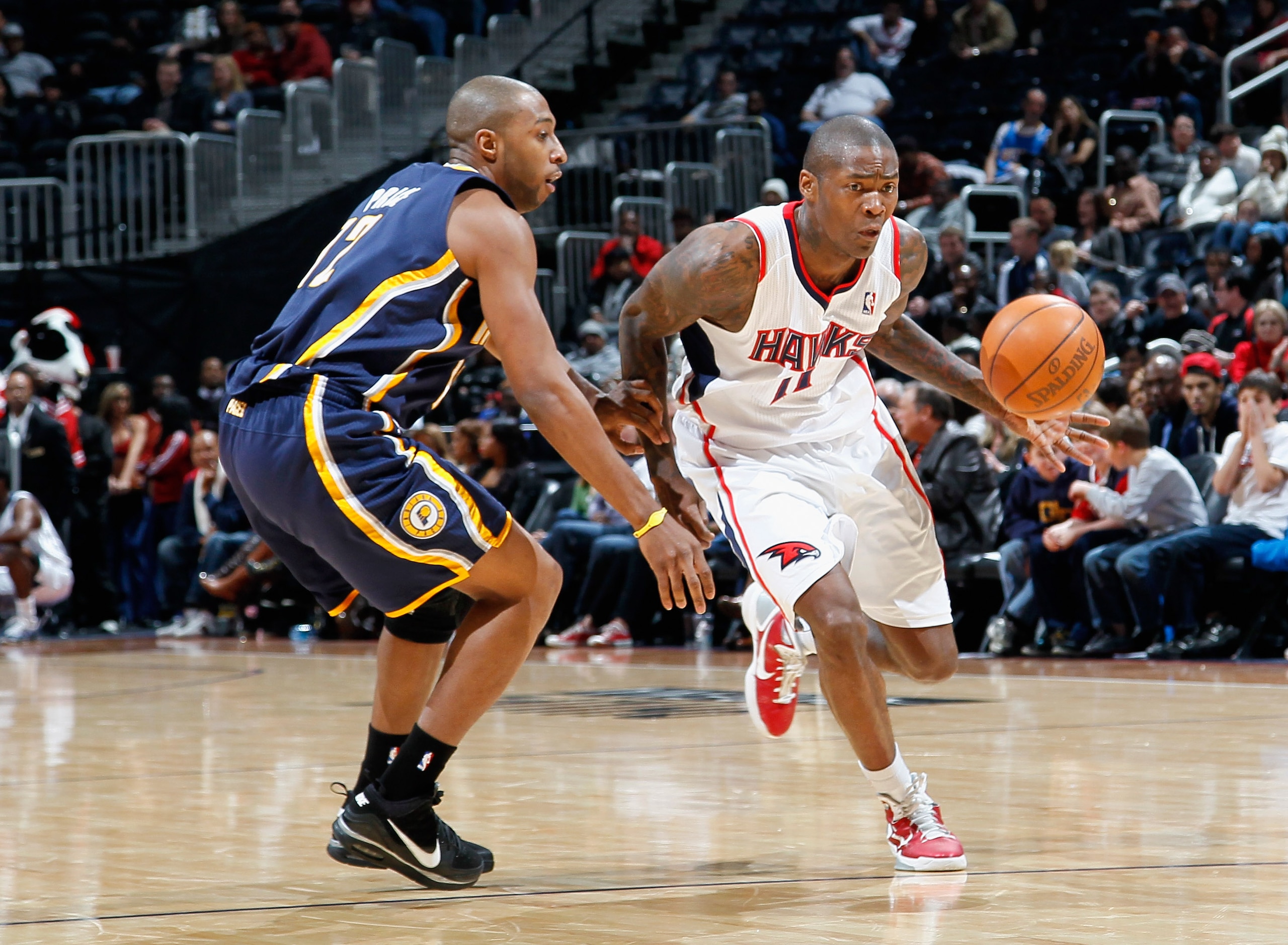 ATLANTA, GA - DECEMBER 11: Jamal Crawford #25 of the Atlanta Hawks against A.J. Price #12 of the Indiana Pacers at Philips Arena on December 11, 2010 in Atlanta, Georgia. NOTE TO USER: User expressly acknowledges and agrees that, by downloading and/or u ATLANTA, GA - DECEMBER 11: Jamal Crawford #25 of the Atlanta Hawks against A.J. Price #12 of the Indiana Pacers at Philips Arena on December 11, 2010 in Atlanta, Georgia. NOTE TO USER: User expressly acknowledges and agrees that, by downloading and/or u