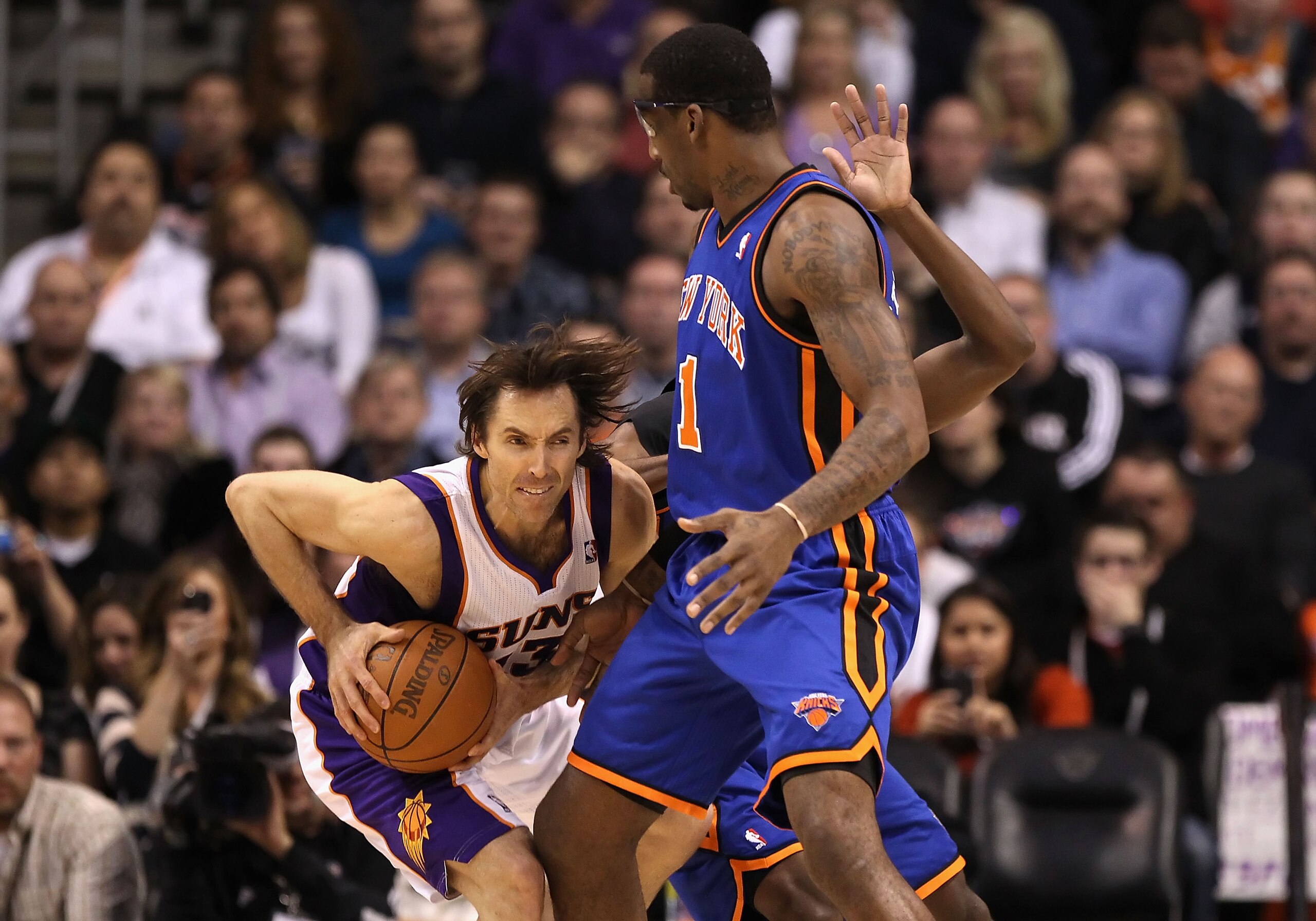 PHOENIX - JANUARY 07: Steve Nash #13 of the Phoenix Suns handles the ball under pressure from Amar'e Stoudemire #1 of the New York Knicks during the NBA game at US Airways Center on January 7, 2011 in Phoenix, Arizona. NOTE TO USER: User expressly ackn PHOENIX - JANUARY 07: Steve Nash #13 of the Phoenix Suns handles the ball under pressure from Amar'e Stoudemire #1 of the New York Knicks during the NBA game at US Airways Center on January 7, 2011 in Phoenix, Arizona. NOTE TO USER: User expressly ackn