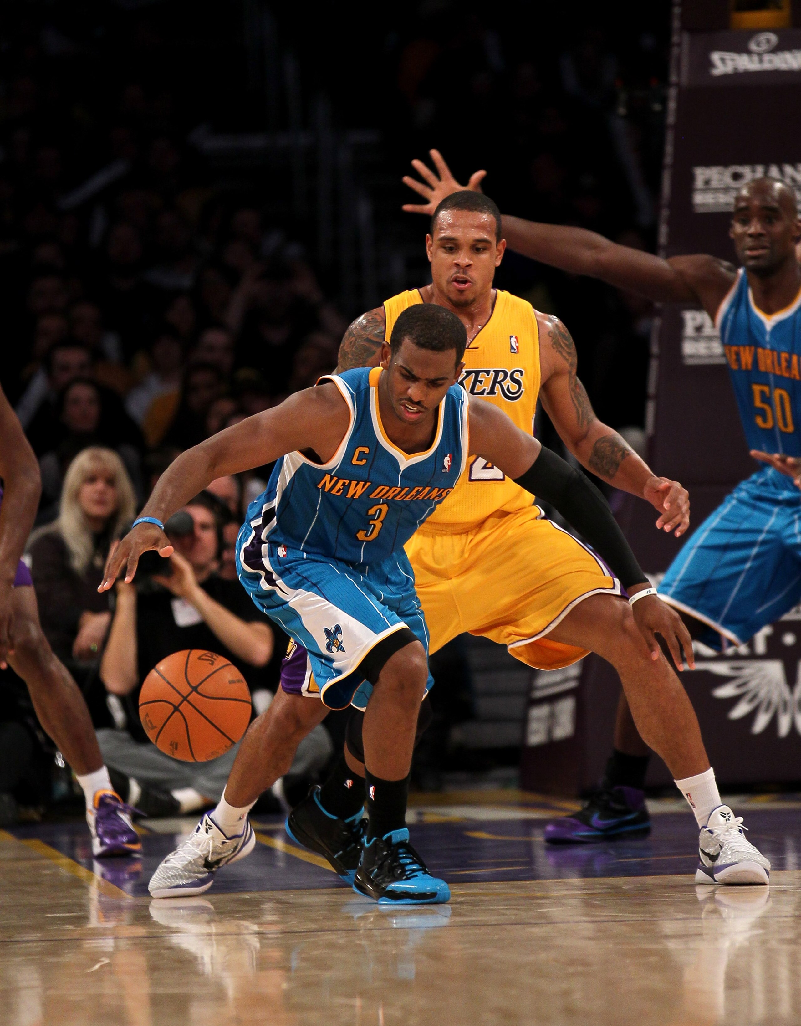LOS ANGELES, CA - JANUARY 7: Chris Paul #3 of the New Orleans Hornets controls the ball in front of Shannon Brown #12 of the Los Angeles Lakers at Staples Center on January 7, 2011 in Los Angeles, California. The Lakers won 101-97. NOTE TO USER: User e LOS ANGELES, CA - JANUARY 7: Chris Paul #3 of the New Orleans Hornets controls the ball in front of Shannon Brown #12 of the Los Angeles Lakers at Staples Center on January 7, 2011 in Los Angeles, California. The Lakers won 101-97. NOTE TO USER: User e
