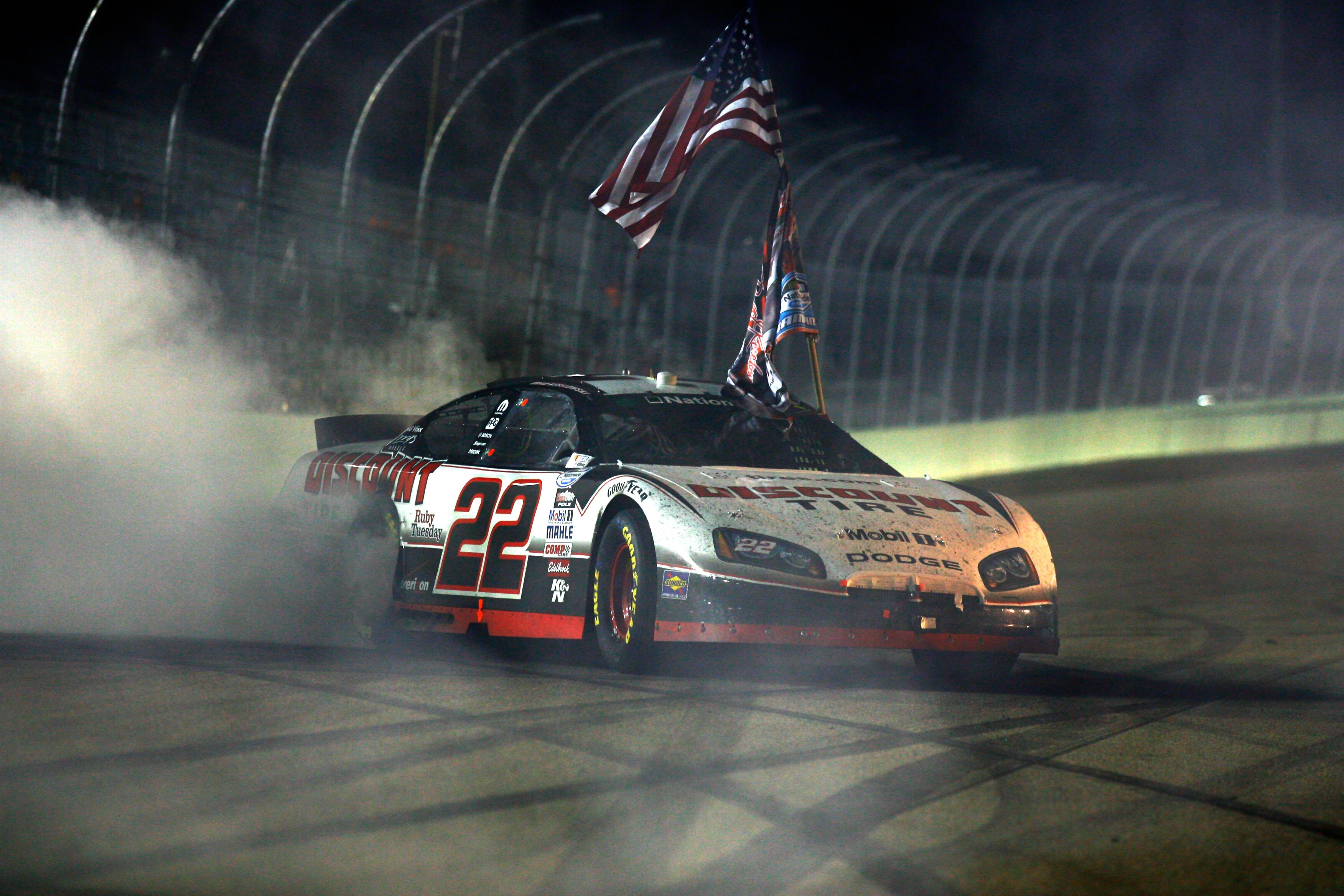 HOMESTEAD, FL - NOVEMBER 20:  Brad Keselowski, driver of the #22 Discount Tire Dodge, celebrates winning the NASCAR Nationwide Series championship with a burnout following the Ford 300 at Homestead-Miami Speedway on November 20, 2010 in Homestead, Florida
