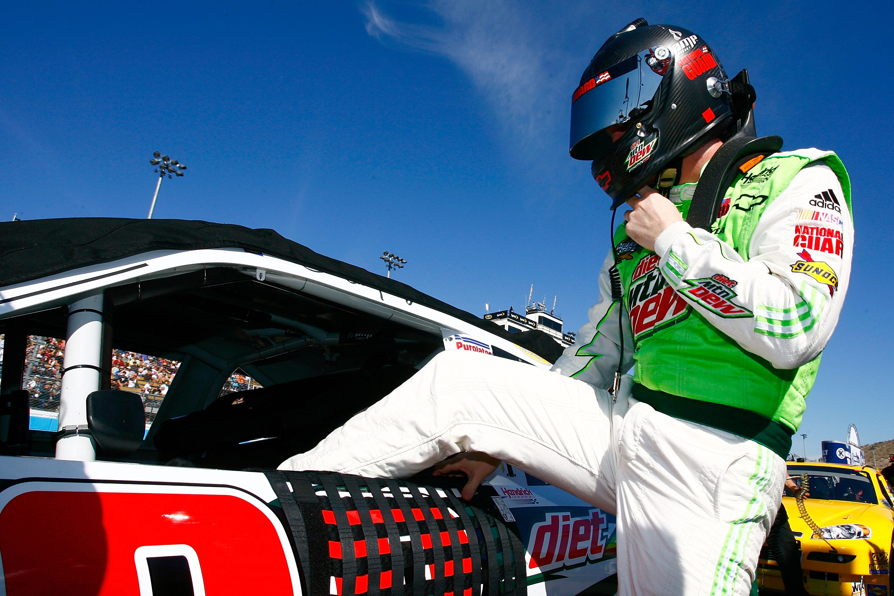 AVONDALE, AZ - NOVEMBER 14:  Dale Earnhardt Jr., driver of the #88 Diet Mountain Dew Chevrolet, climbs in to his car prior to the NASCAR Sprint Cup Series Kobalt Tools 500 at Phoenix International Raceway on November 14, 2010 in Avondale, Arizona.  (Photo