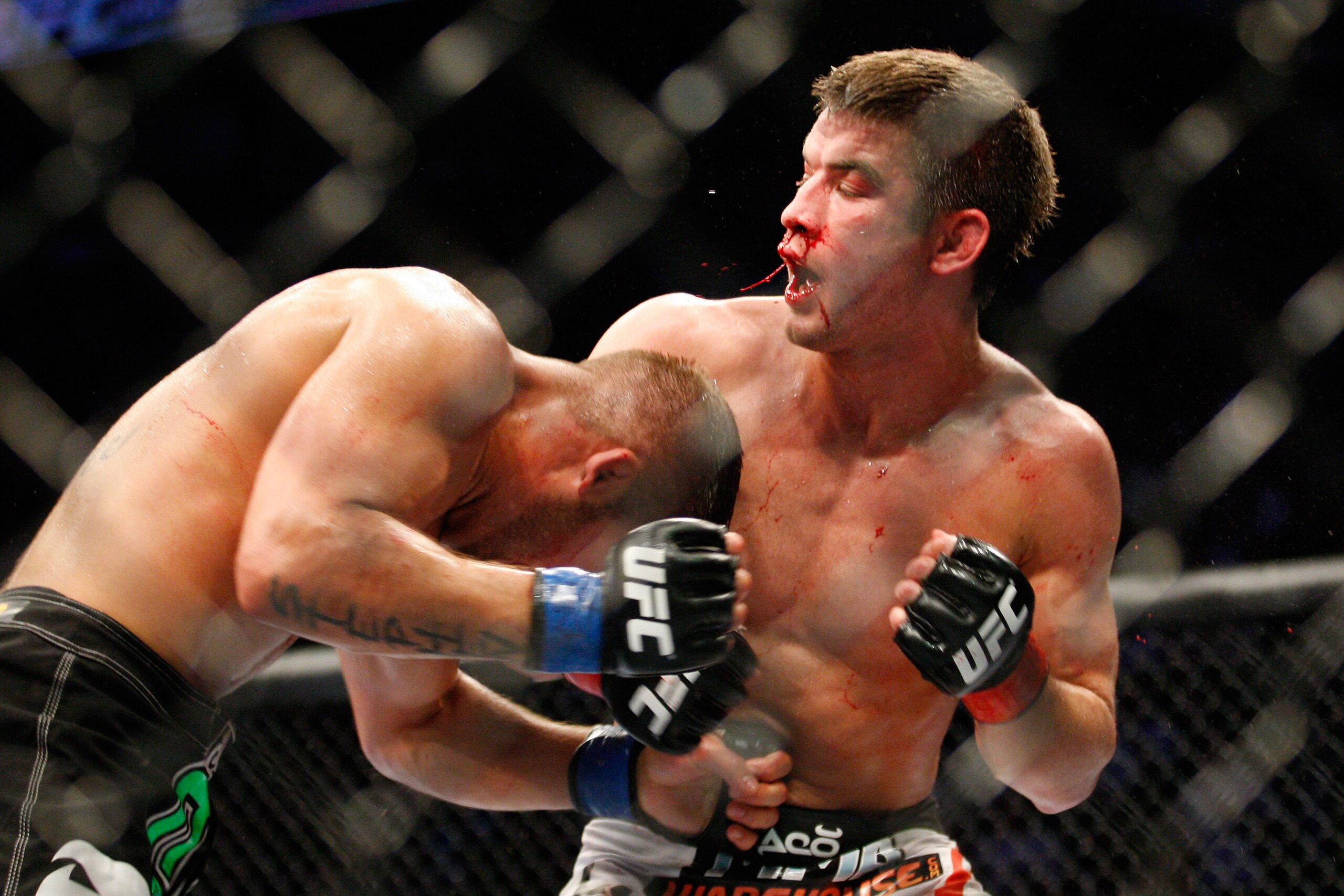 MONTREAL- MAY 8: Jeremy Stephens (L) punches Sam Stout in the stomach in their lightweight 'swing' bout at UFC 113 at Bell Centre on May 8, 2010 in Montreal, Quebec, Canada.  (Photo by Richard Wolowicz/Getty Images)