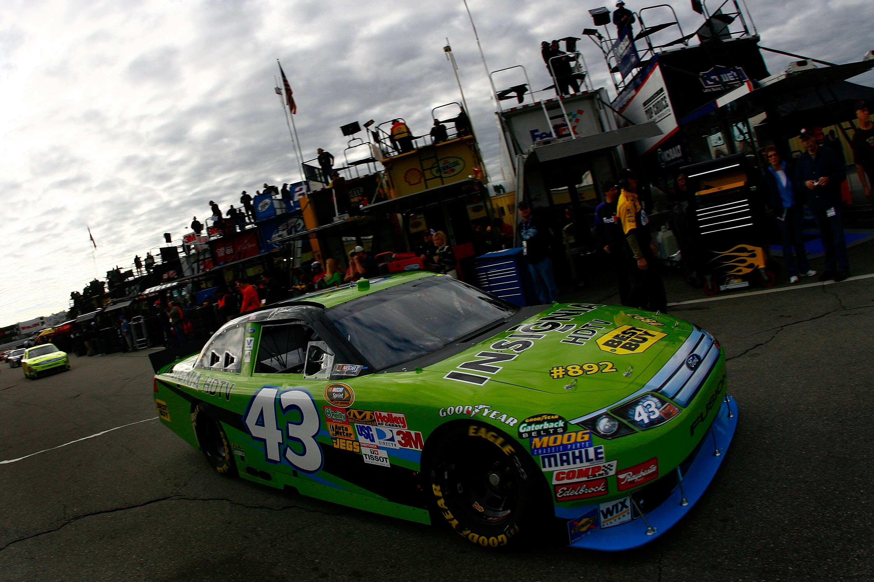 LOUDON, NH - SEPTEMBER 18:  AJ Allmendinger, driver of the #43 Insignia HDTV Ford, drives through the garage area during practice for the NASCAR Sprint Cup Series Sylvania 300 at New Hampshire Motor Speedway on September 18, 2010 in Loudon, New Hampshire.