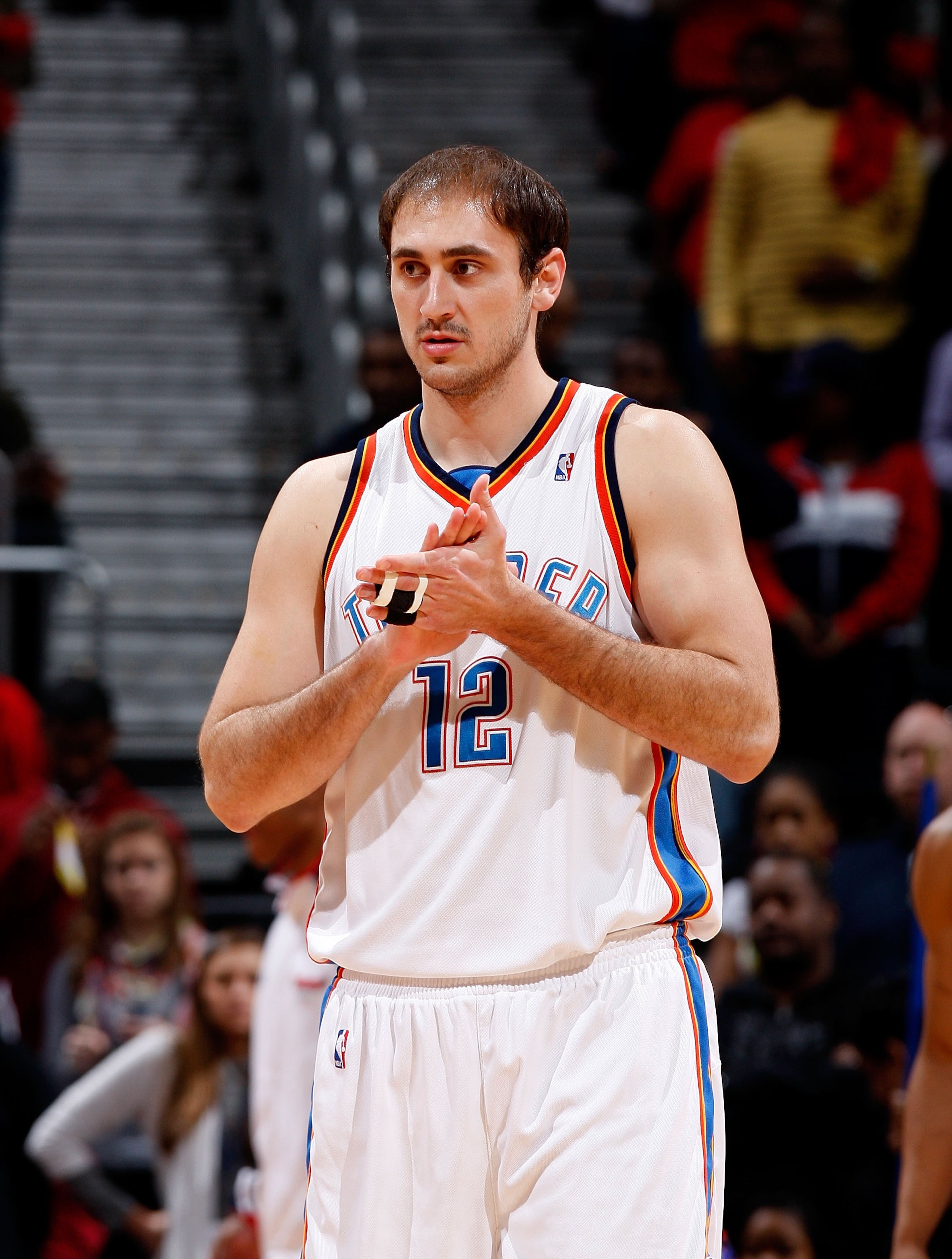 ATLANTA - JANUARY 18: Nenad Krstic #12 of the Oklahoma City Thunder against the Atlanta Hawks at Philips Arena on January 18, 2010 in Atlanta, Georgia. NOTE TO USER: User expressly acknowledges and agrees that, by downloading and/or using this Photograp ATLANTA - JANUARY 18: Nenad Krstic #12 of the Oklahoma City Thunder against the Atlanta Hawks at Philips Arena on January 18, 2010 in Atlanta, Georgia. NOTE TO USER: User expressly acknowledges and agrees that, by downloading and/or using this Photograp