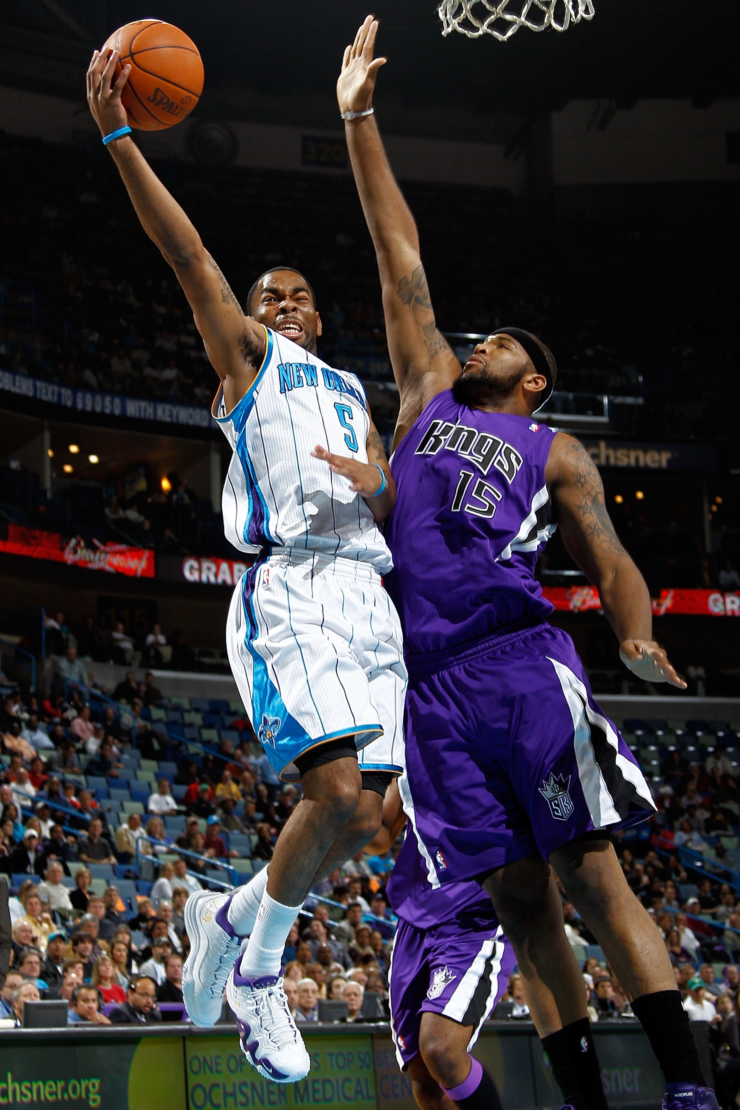 NEW ORLEANS, LA - DECEMBER 15:  Marcus Thornton #5 of the New Orleans Hornets shoots the ball over DeMarcus Cousins #15 of the Sacramento Kings at the New Orleans Arena on December 15, 2010 in New Orleans, Louisiana.  NOTE TO USER: User expressly acknowle
