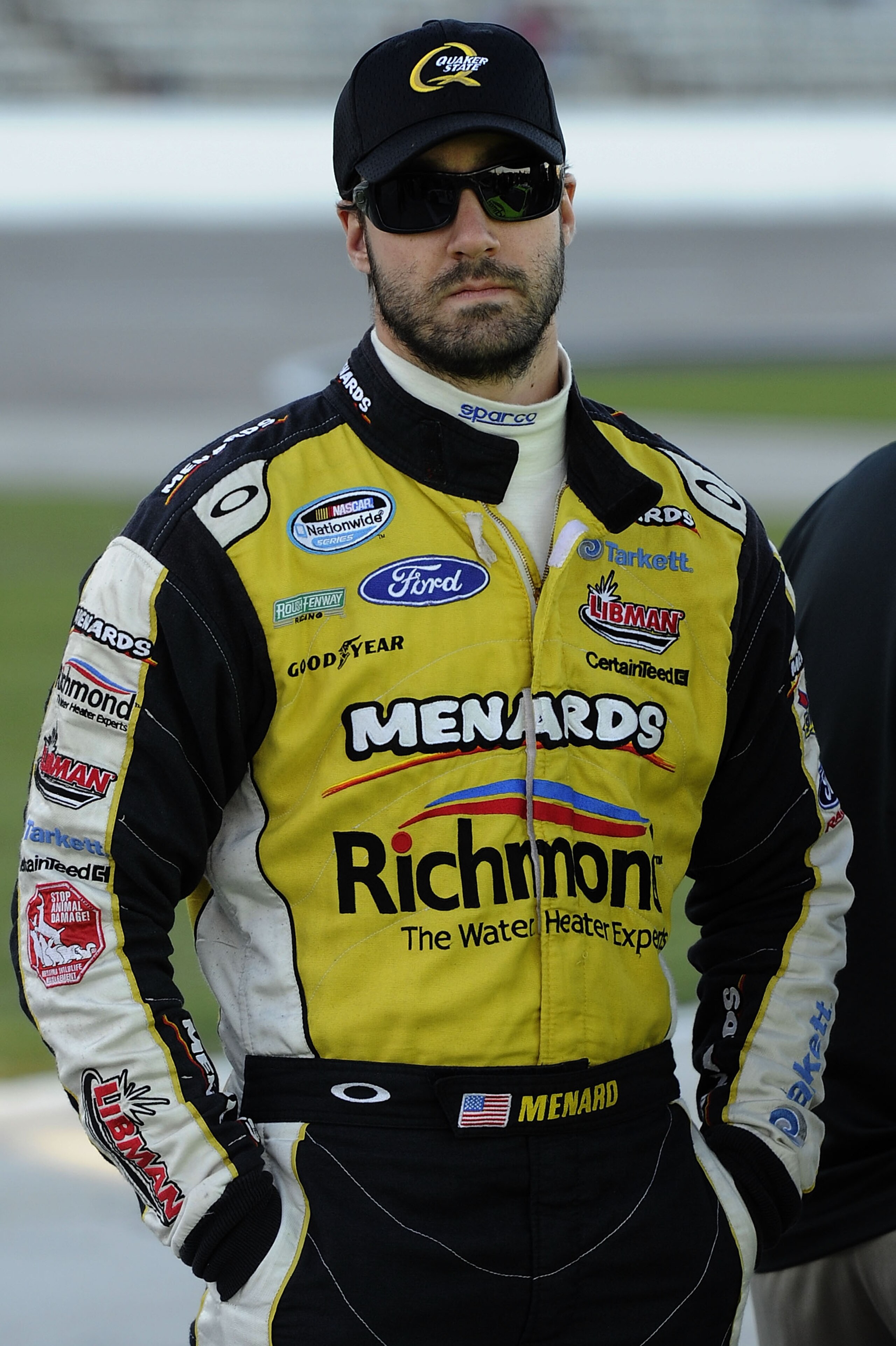 FORT WORTH, TX - NOVEMBER 05:  Paul Menard, driver of the #98 Richmond/Menards Ford, stands on the grid during qualifying for the NASCAR Nationwide Series O'Reilly Auto Parts Challenge at Texas Motor Speedway on November 5, 2010 in Fort Worth, Texas.  (Ph