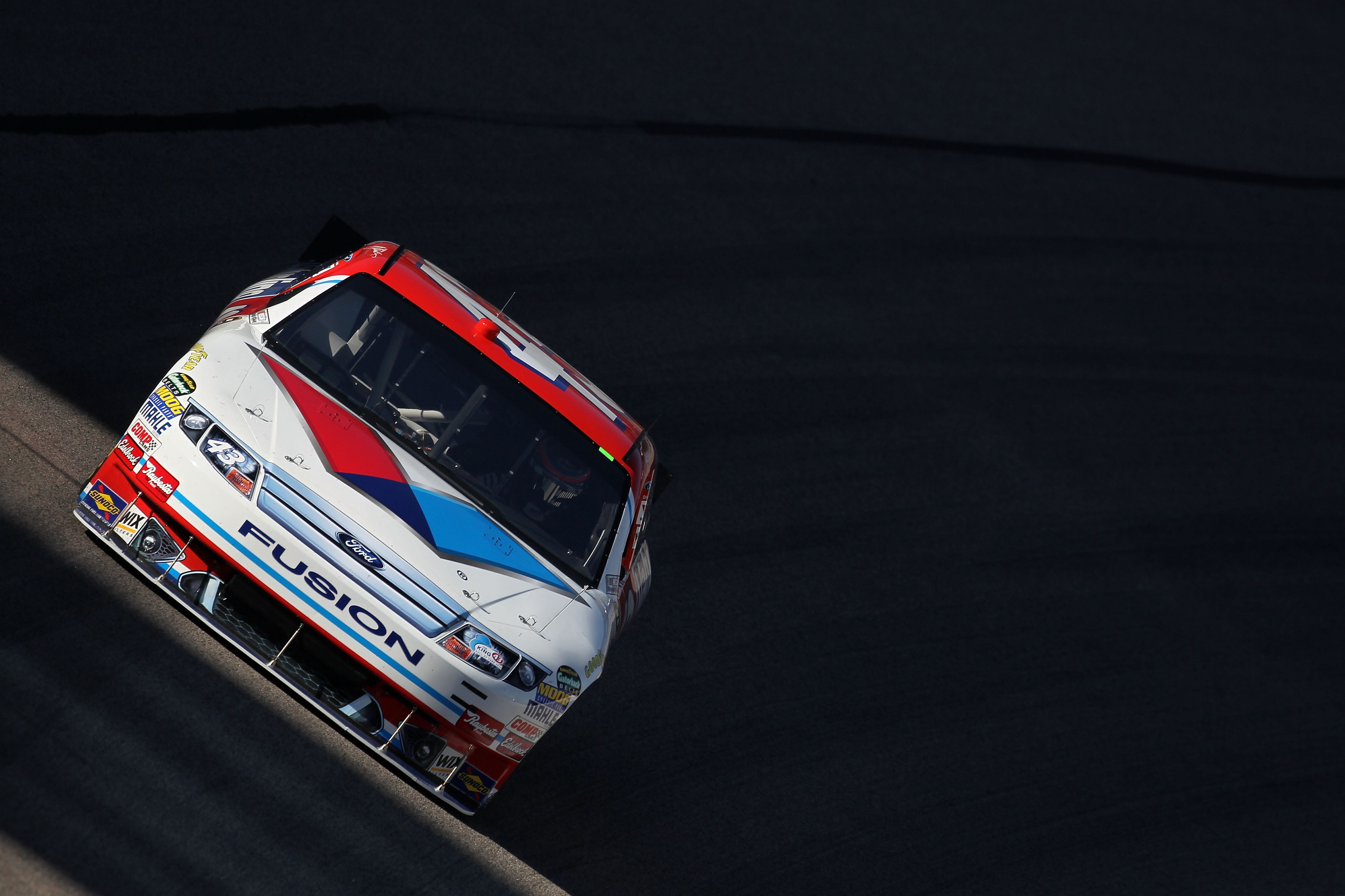 FORT WORTH, TX - NOVEMBER 05:  A.J. Allmendinger drives the #43 Valvoline Ford during practice for the NASCAR Sprint Cup Series AAA Texas 500 at Texas Motor Speedway on November 5, 2010 in Fort Worth, Texas.  (Photo by Jonathan Ferrey/Getty Images for NAS