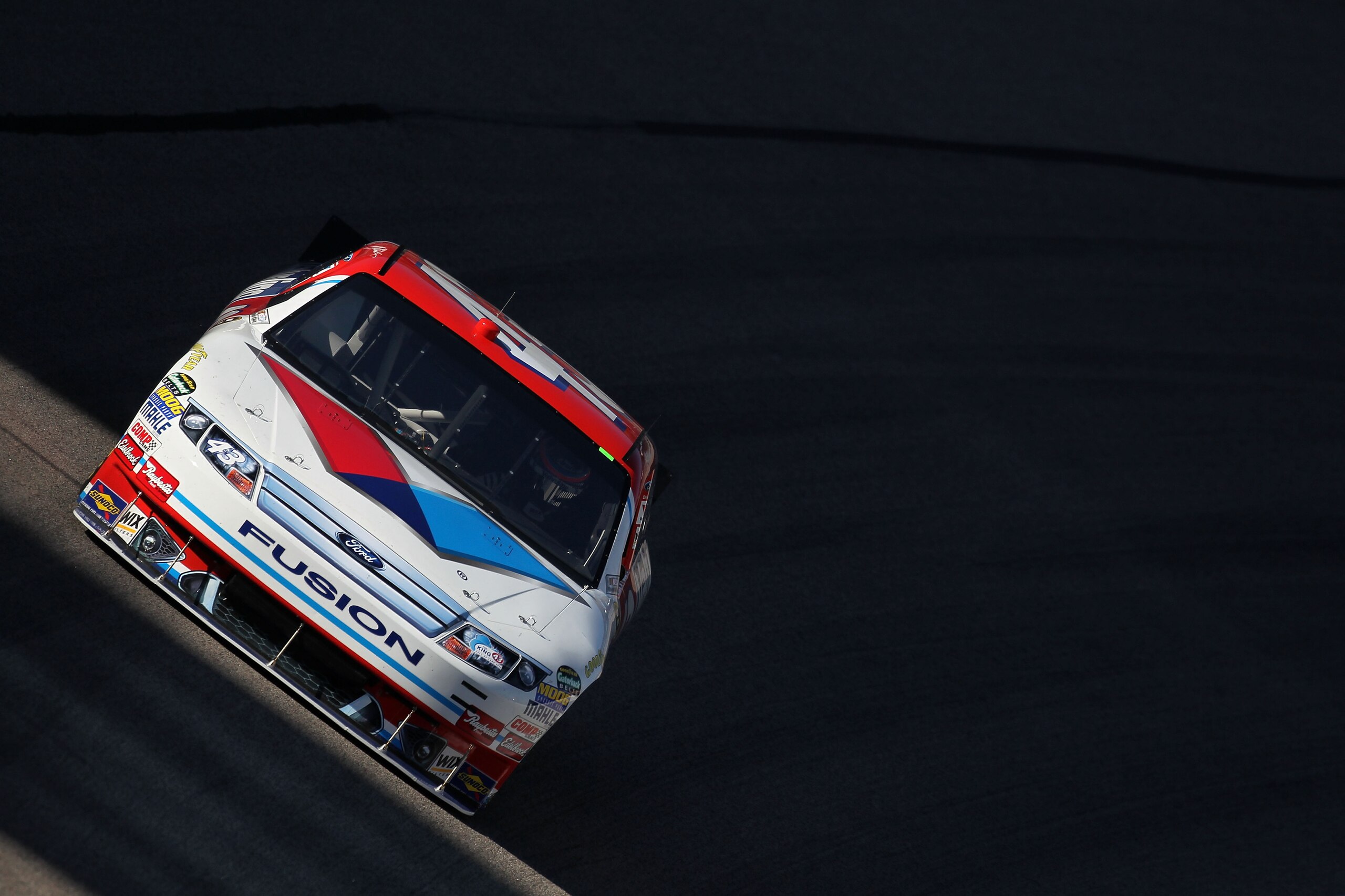 FORT WORTH, TX - NOVEMBER 05:  A.J. Allmendinger drives the #43 Valvoline Ford during practice for the NASCAR Sprint Cup Series AAA Texas 500 at Texas Motor Speedway on November 5, 2010 in Fort Worth, Texas.  (Photo by Jonathan Ferrey/Getty Images for NAS