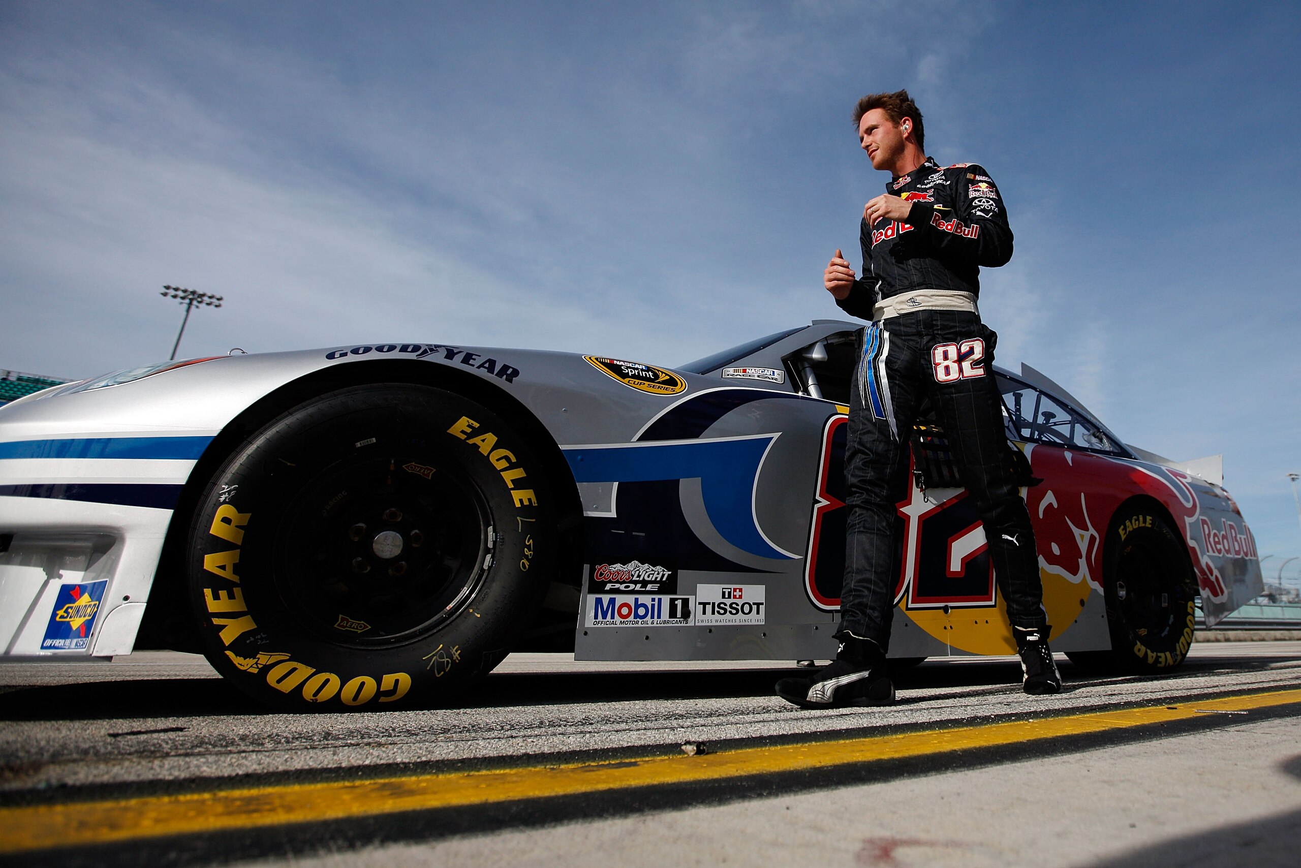 HOMESTEAD, FL - NOVEMBER 19:  Scott Speed, driver of the #82 Red Bull Toyota, walks by his car during qualifying for the NASCAR Sprint Cup Series Ford 400 at Homestead-Miami Speedway on November 19, 2010 in Homestead, Florida.  (Photo by Chris Graythen/Ge