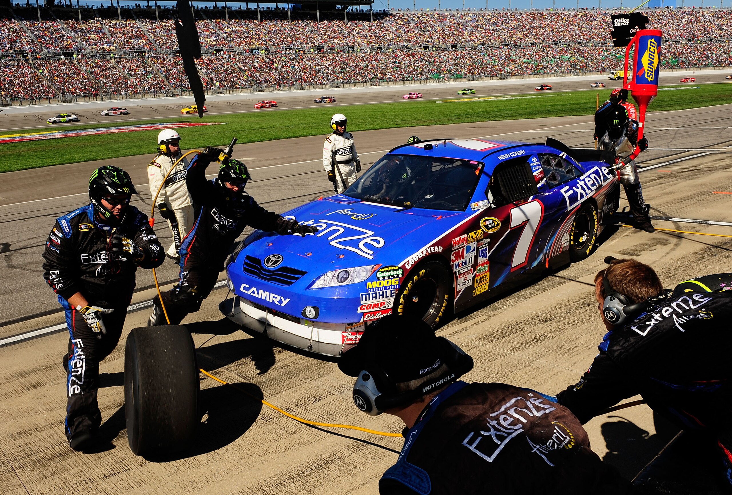 KANSAS CITY, KS - OCTOBER 03:  Kevin Conway, driver of the #7 Extenze Toyota, makes a pit stop during the NASCAR Sprint Cup Series Price Chopper 400 on October 3, 2010 in Kansas City, Kansas.  (Photo by Rusty Jarrett/Getty Images for NASCAR)