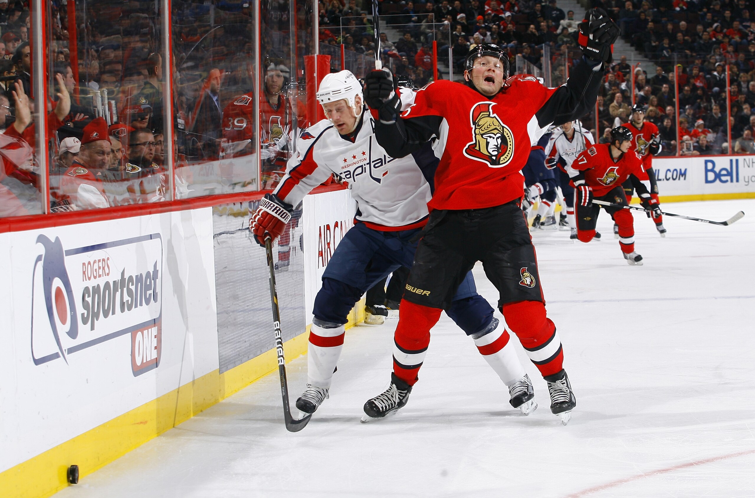 OTTAWA, ON - DECEMBER 19: Jason Chimera #25 of the Washington Capitals takes a holding penalty by pulling Sergei Gonchar #55 of the Ottawa Senators from behind while forechecking in a game at Scotiabank Place on December 19, 2010 in Ottawa, Canada. (Pho OTTAWA, ON - DECEMBER 19: Jason Chimera #25 of the Washington Capitals takes a holding penalty by pulling Sergei Gonchar #55 of the Ottawa Senators from behind while forechecking in a game at Scotiabank Place on December 19, 2010 in Ottawa, Canada. (Pho