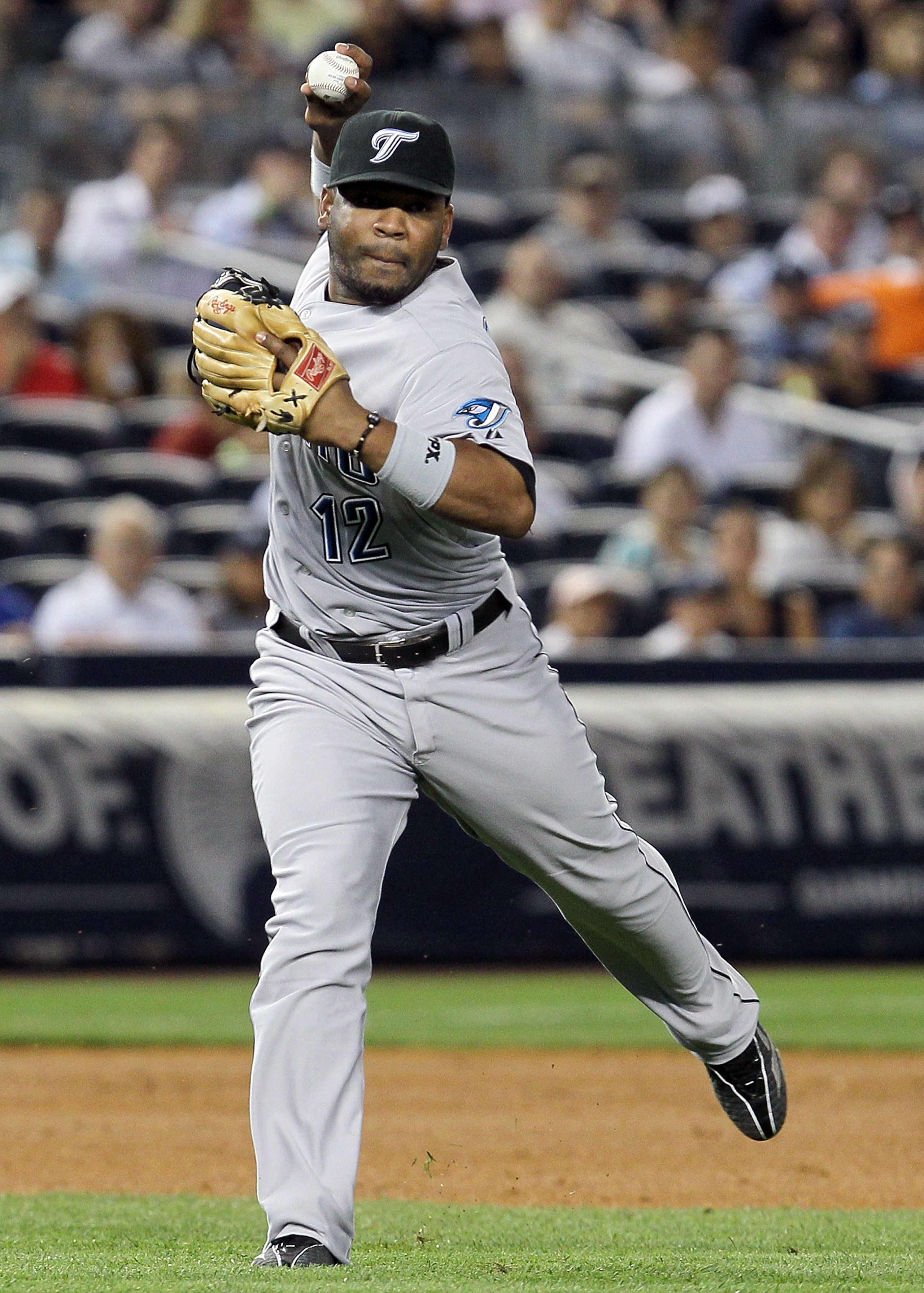 NEW YORK - AUGUST 03:  Edwin Encarnacion #12 of the Toronto Blue Jays in action against of the New York Yankees on August 3, 2010 at Yankee Stadium in the Bronx borough of New York City. The Jays defeated the Yankees 8-2.  (Photo by Jim McIsaac/Getty Imag