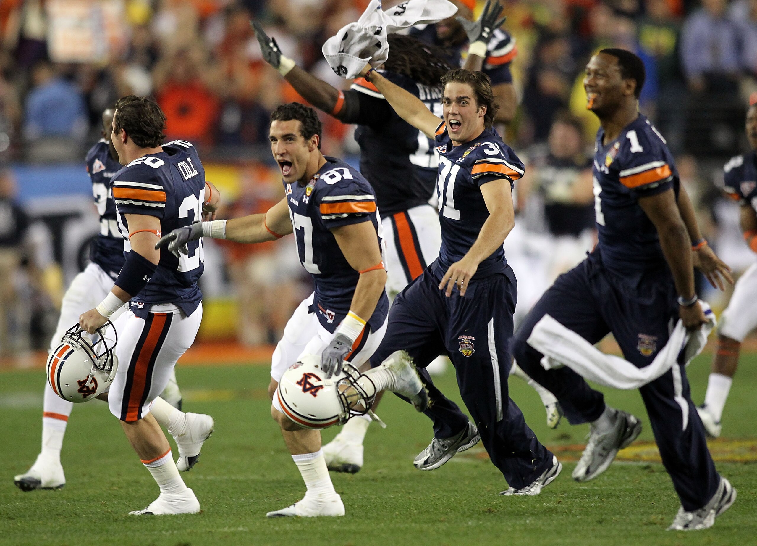 GLENDALE, AZ - JANUARY 10:  Derek Winter #87 and Trent Fisher #31 of the Auburn Tigers react after kicker Wes Byrum #18 of the Auburn Tigers kicks a 19-yard game-winning field goal to defeat the Oregon Ducks 22-19 during the Tostitos BCS National Champion