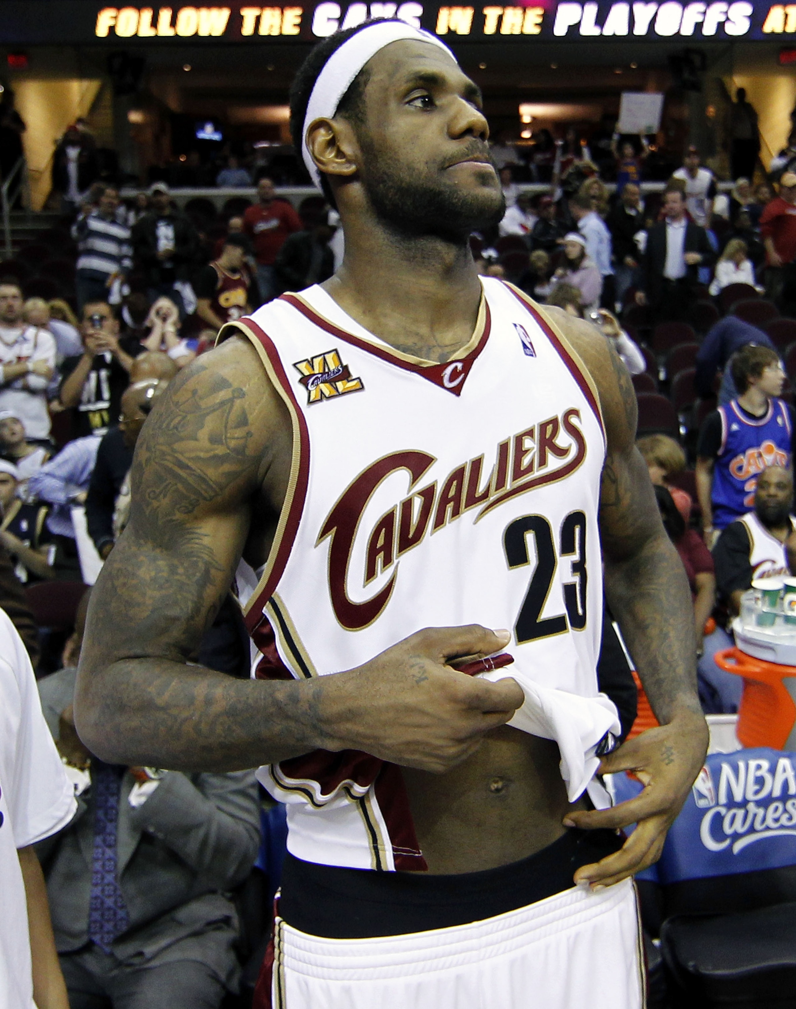 CLEVELAND - MAY 11:  LeBron James #23 of the Cleveland Cavaliers untucks his jersey after being defeated 120-88 by the Boston Celtics in Game Five of the Eastern Conference Semifinals during the 2010 NBA Playoffs at Quicken Loans Arena on May 11, 2010 in