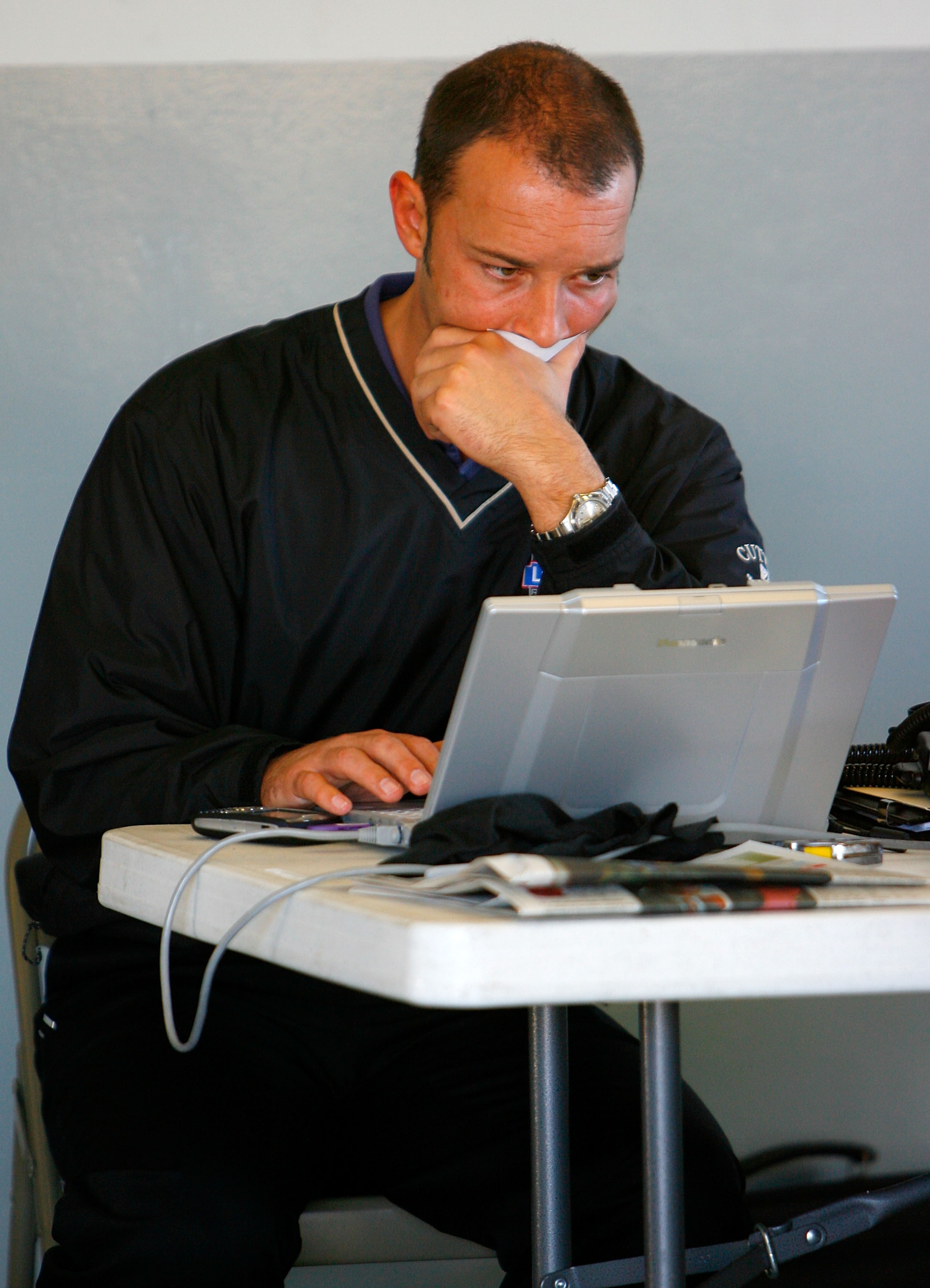 DAYTONA BEACH, FL - JANUARY 09: Chad Knauss, crew chief for the #48 Lowes Chevrolet driven by Jimmie Johnson working on his laptop in the garage during NASCAR testing at Daytona International Speedway on January 9, 2008 in Daytona Beach, Florida.  (Photo