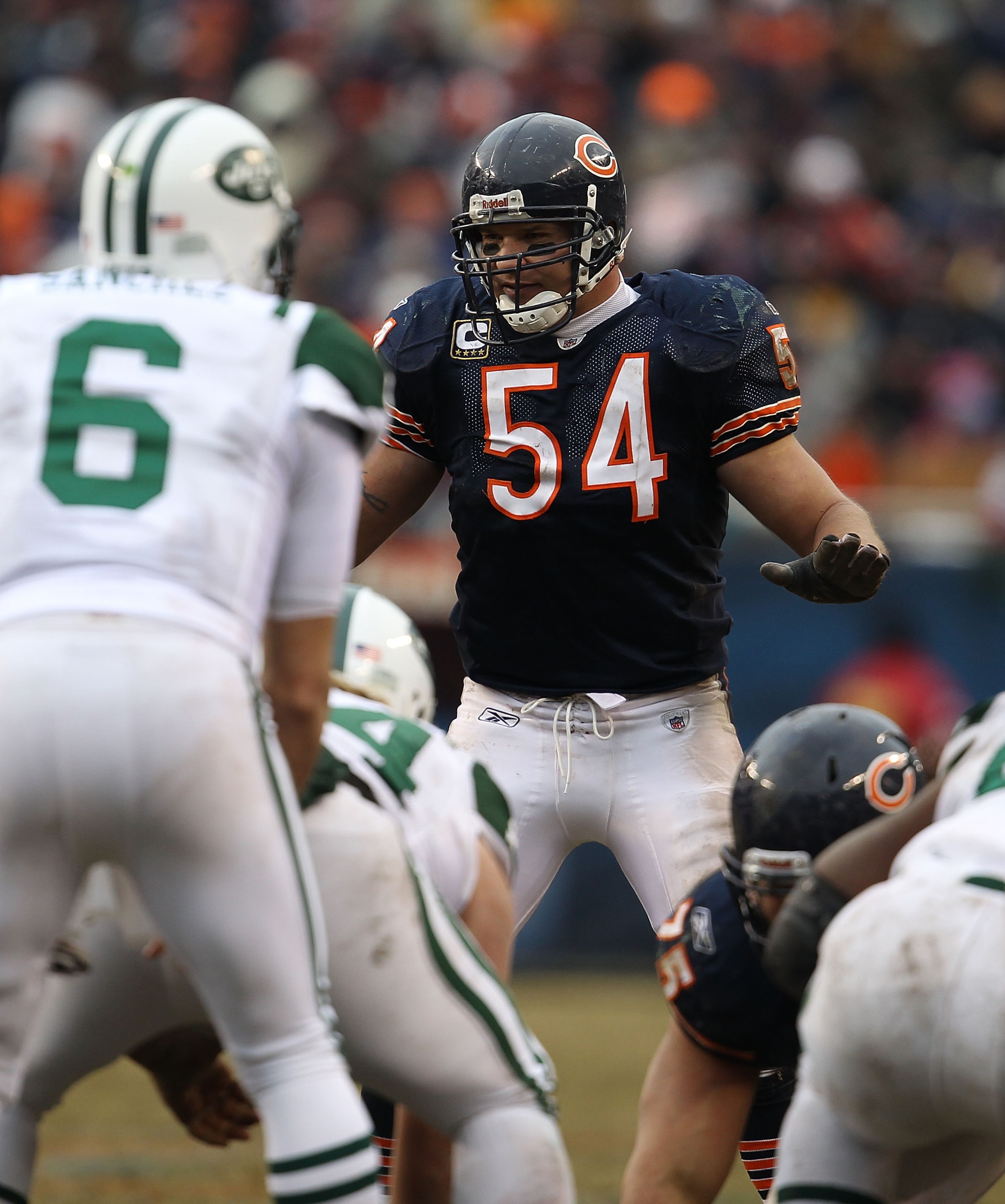 CHICAGO, IL - DECEMBER 26: Brian Urlacher #54 of the Chicago Bears awaits the start of play as Mark Sanchez #6 of the New York Jets calls offensive signals at Soldier Field on December 26, 2010 in Chicago, Illinois. The Bears defeated the Jets 38-34.  (Ph