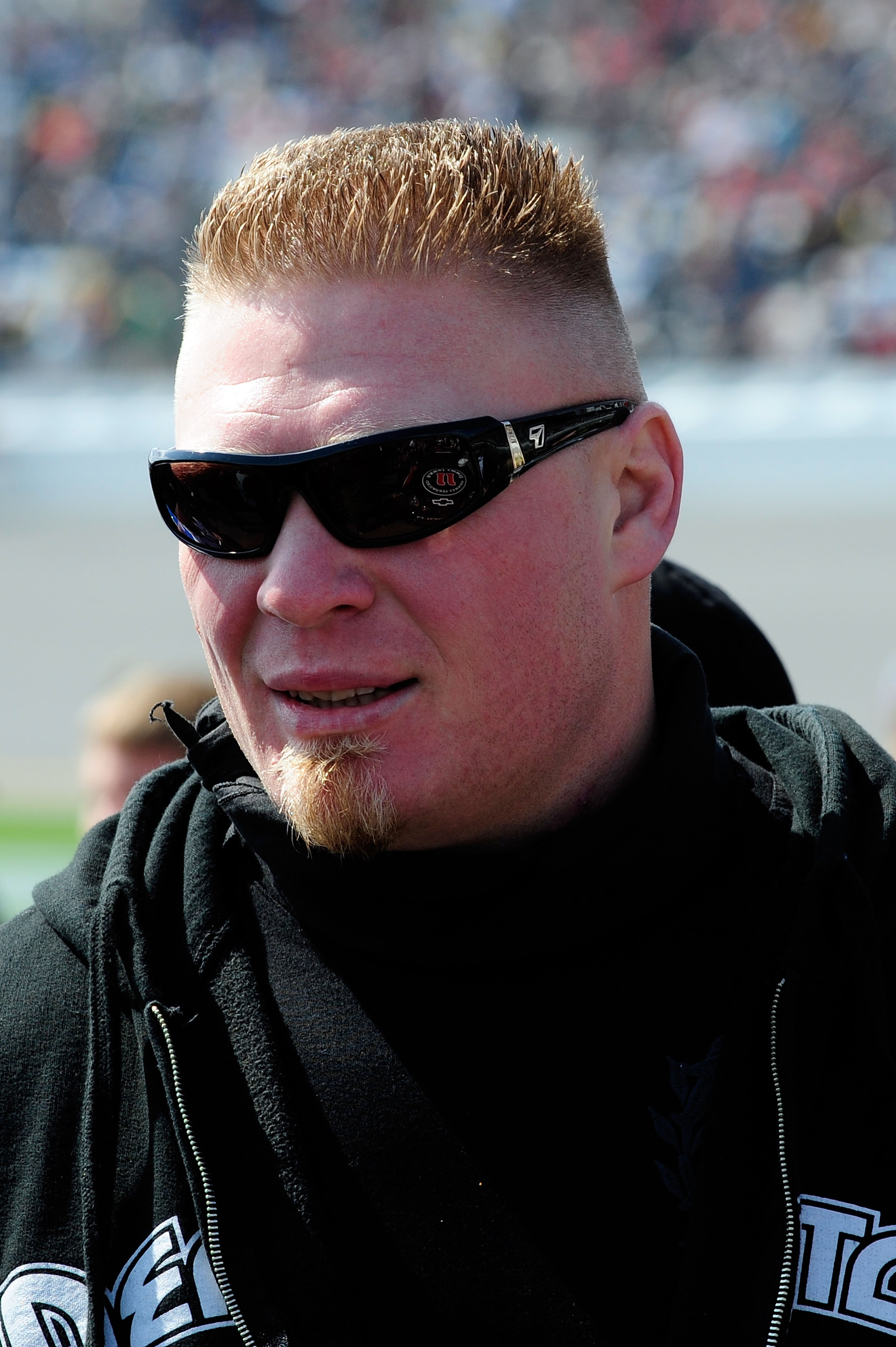 DAYTONA BEACH, FL - FEBRUARY 13: MMA fighter Brock Lesnar walks in the garage area during the NASCAR Nationwide Series Drive4COPD 300 at Daytona International Speedway on February 13, 2010 in Daytona Beach, Florida. (Photo by Sam Greenwood/Getty Images) DAYTONA BEACH, FL - FEBRUARY 13: MMA fighter Brock Lesnar walks in the garage area during the NASCAR Nationwide Series Drive4COPD 300 at Daytona International Speedway on February 13, 2010 in Daytona Beach, Florida. (Photo by Sam Greenwood/Getty Images)
