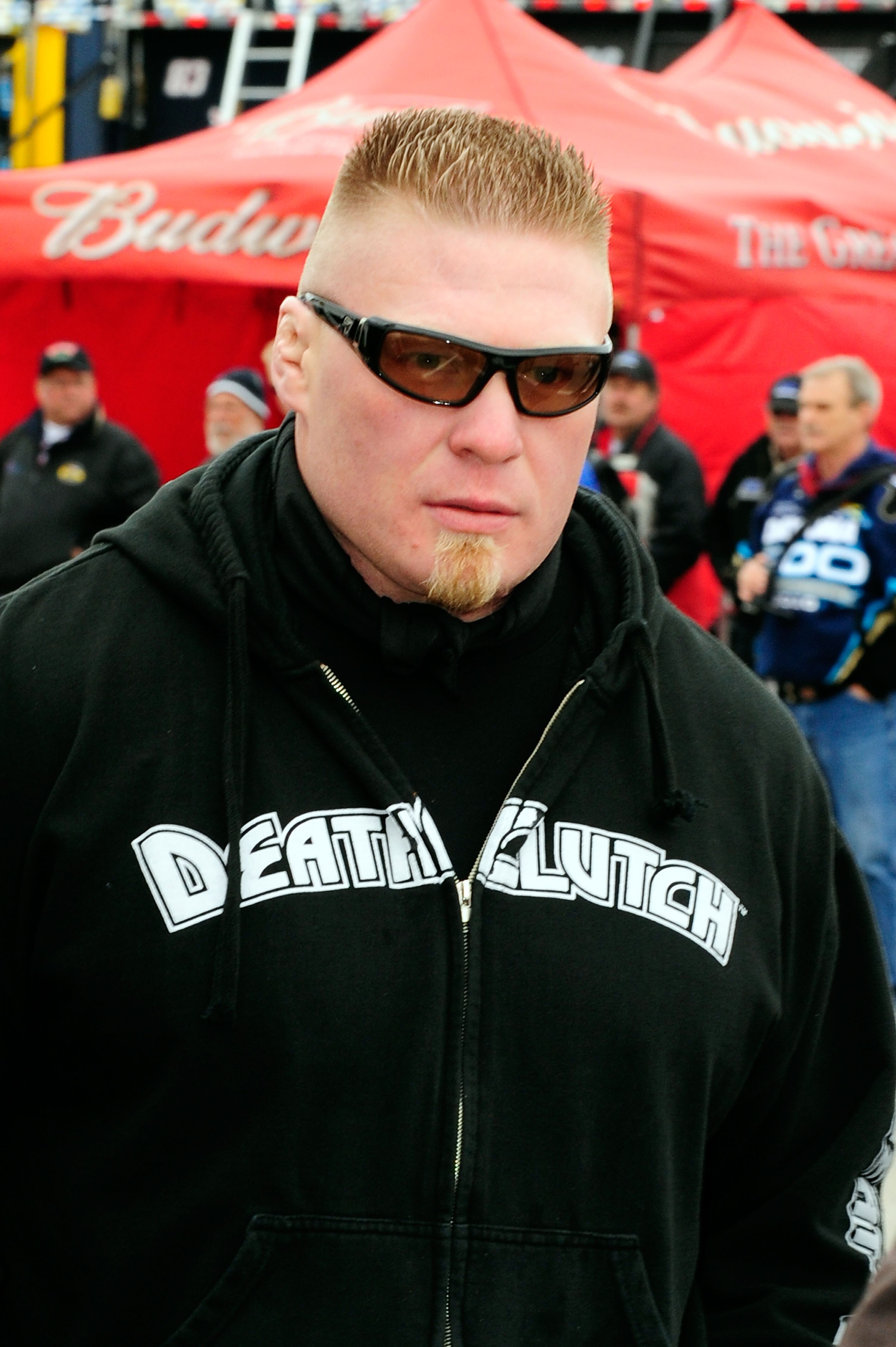 DAYTONA BEACH, FL - FEBRUARY 13:  MMA fighter Brock Lesnar walks in the garage area during practice for the Daytona 500 at Daytona International Speedway on February 13, 2010 in Daytona Beach, Florida.  (Photo by Sam Greenwood/Getty Images for NASCAR)