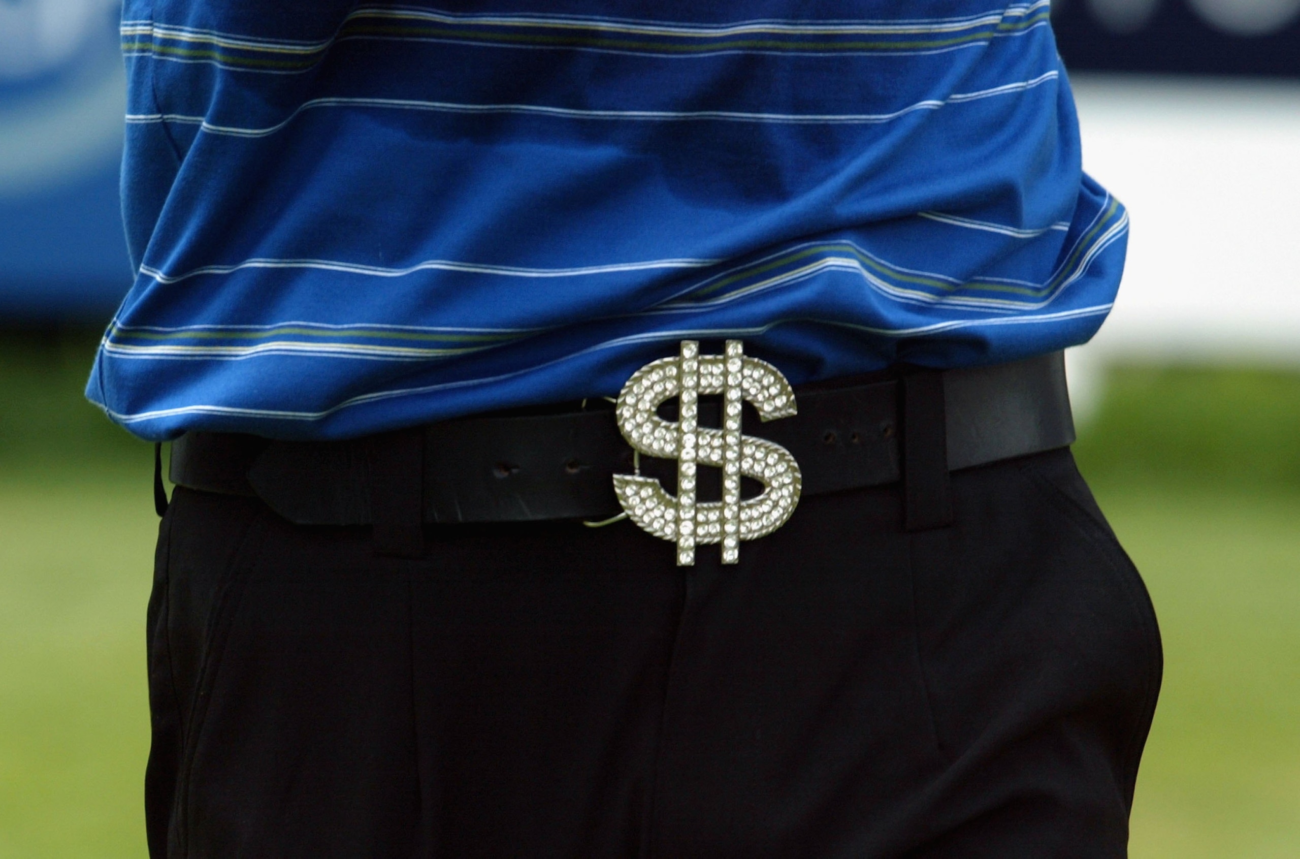 SINGAPORE - SEPTEMBER 10: Shingo Katayama of Japan wears a dollar sign buckle belt on course during the final round of the Singapore Open at the Sentosa Golf Club on September 10, 2006 in Singapore.   (Photo by Stanley Chou/Getty Images)