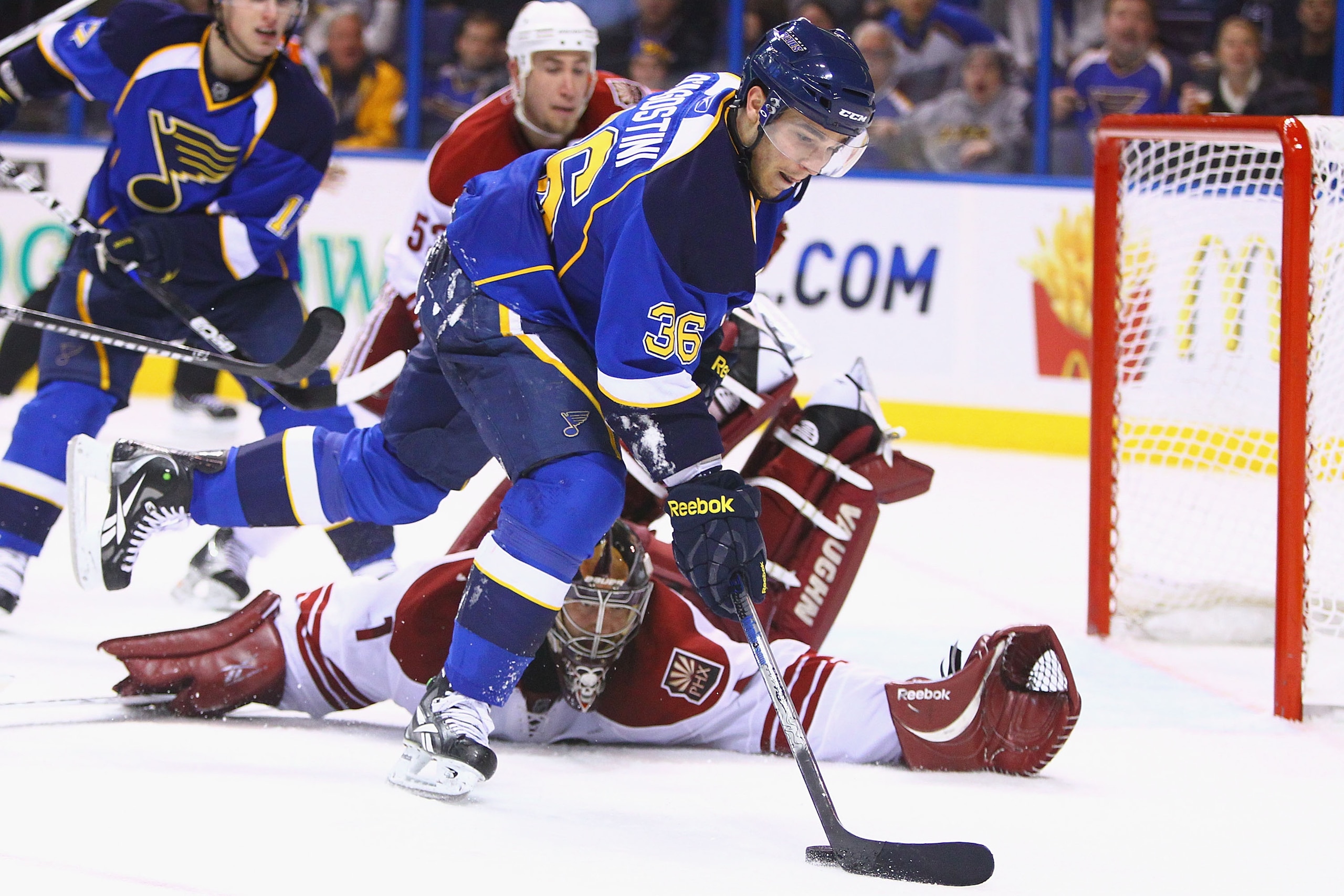ST. LOUIS, MO - JANUARY 10: Matt D'Agostini #36 of the St. Louis Blues shoots against Jason LaBarbera #1 of the Phoenix Coyotes at the Scottrade Center on January 10, 2011 in St. Louis, Missouri.  The Coyotes beat the Blues 4-3.  (Photo by Dilip Vishwanat