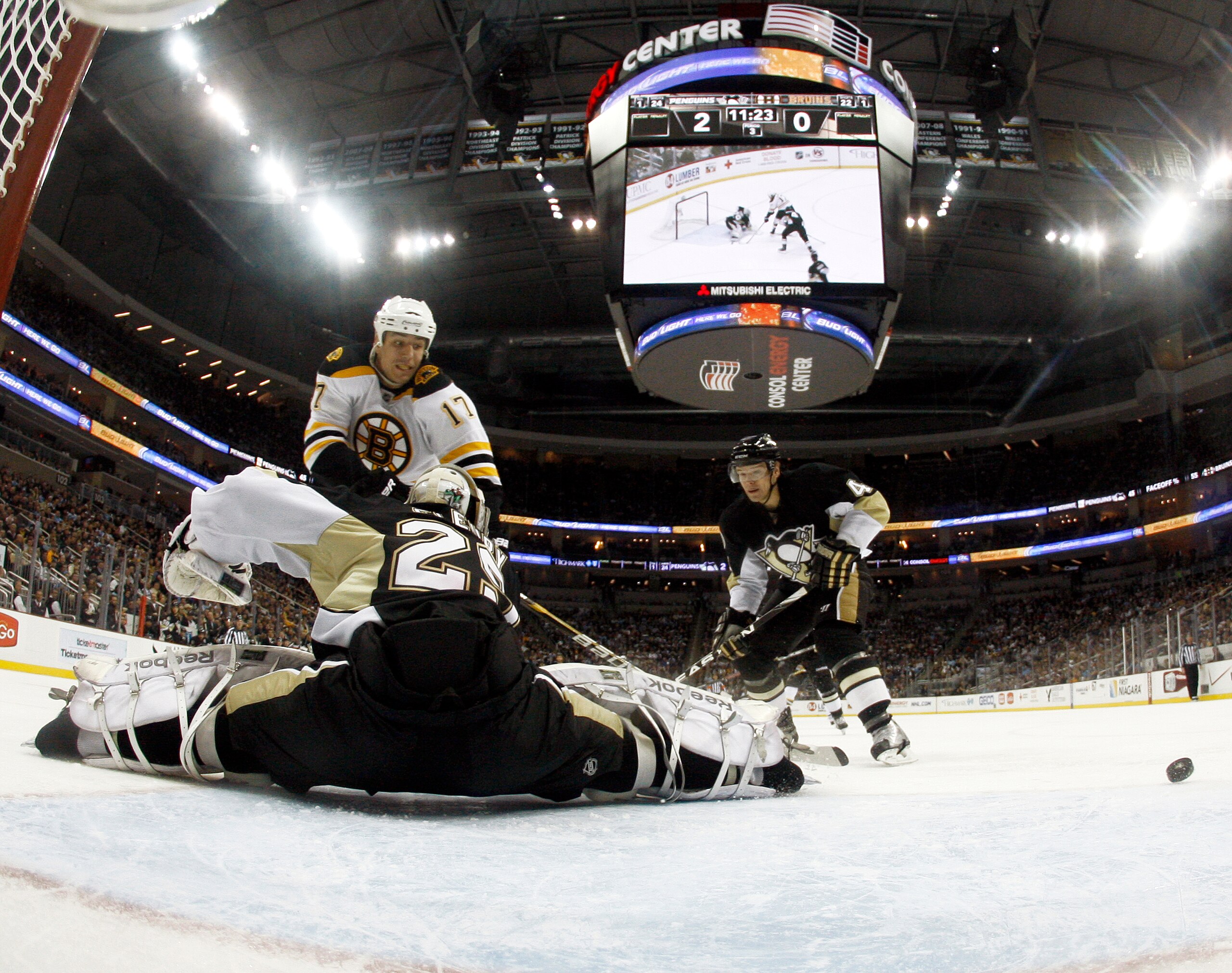 PITTSBURGH, PA - JANUARY 10:  Marc-Andre Fleury #29 of the Pittsburgh Penguins makes a save on Milan Lucic #17 of the Boston Bruins on January 10, 2011 at Consol Energy Center in Pittsburgh, Pennsylvania.  The Bruins defeated the Penguins 4-2.  (Photo by