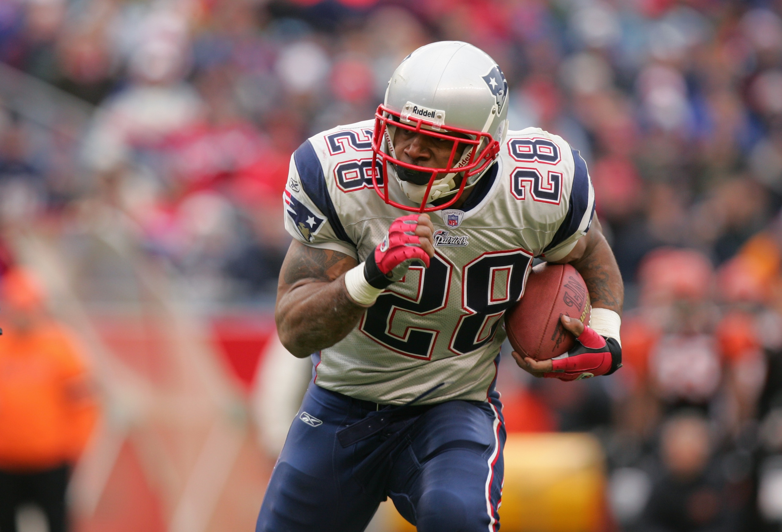 FOXBORO, MA - DECEMBER 12:  Corey Dillon #28 of the New England Patriots carries the ball during the game against the Cincinnati Bengals at Gillette Stadium on December 12, 2004 in Foxboro, Massachusetts. The Patriots won 35-28.  (Photo by Ezra Shaw/Getty