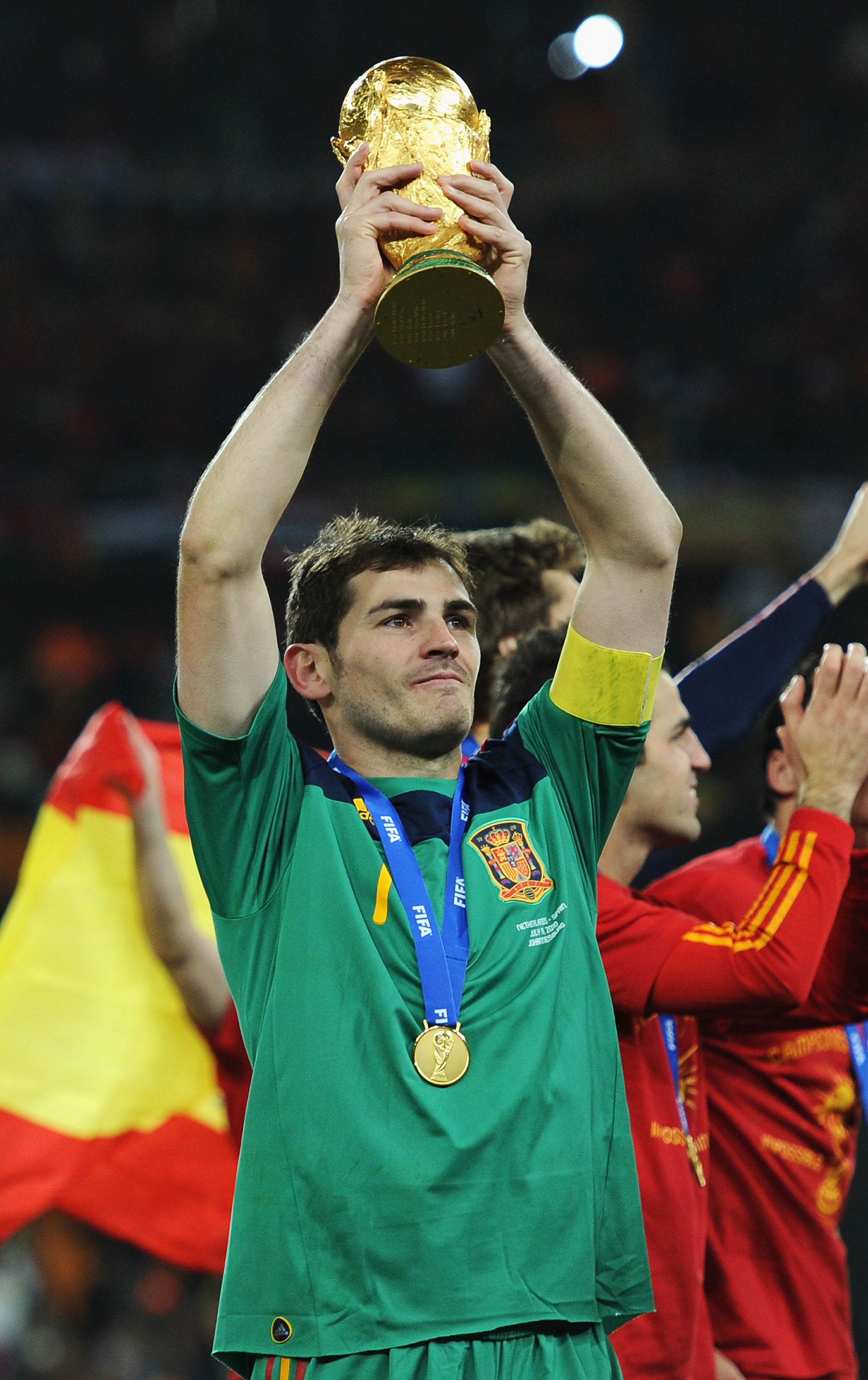 JOHANNESBURG, SOUTH AFRICA - JULY 11: Iker Casillas of Spain lifts the World Cup trophy as the Spain team celebrate victory following the 2010 FIFA World Cup South Africa Final match between Netherlands and Spain at Soccer City Stadium on July 11, 2010 in