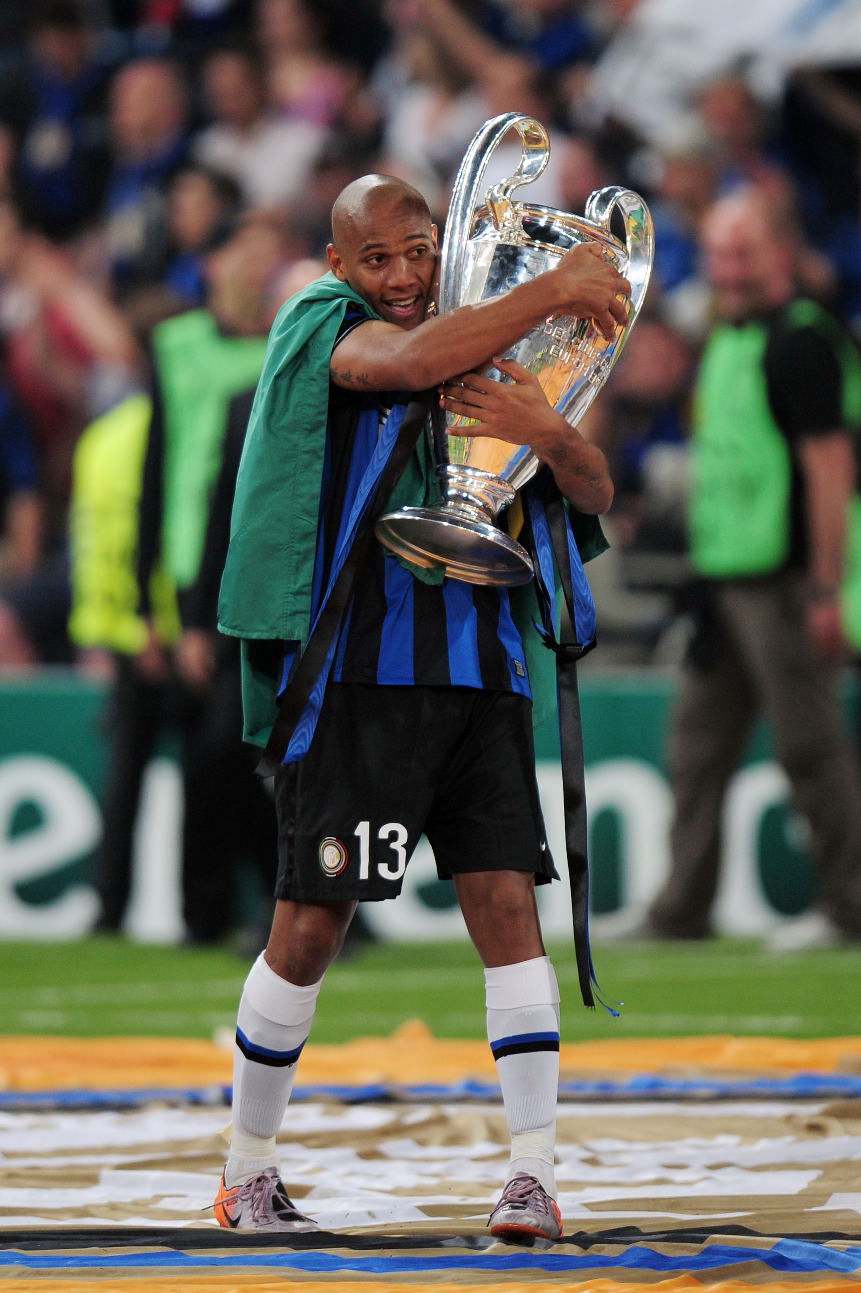 MADRID, SPAIN - MAY 22:  Maicon of Inter Milan celebrates with the UEFA Champions League trophy following his team's victory at the end of the UEFA Champions League Final match between FC Bayern Muenchen and Inter Milan at the Estadio Santiago Bernabeu on