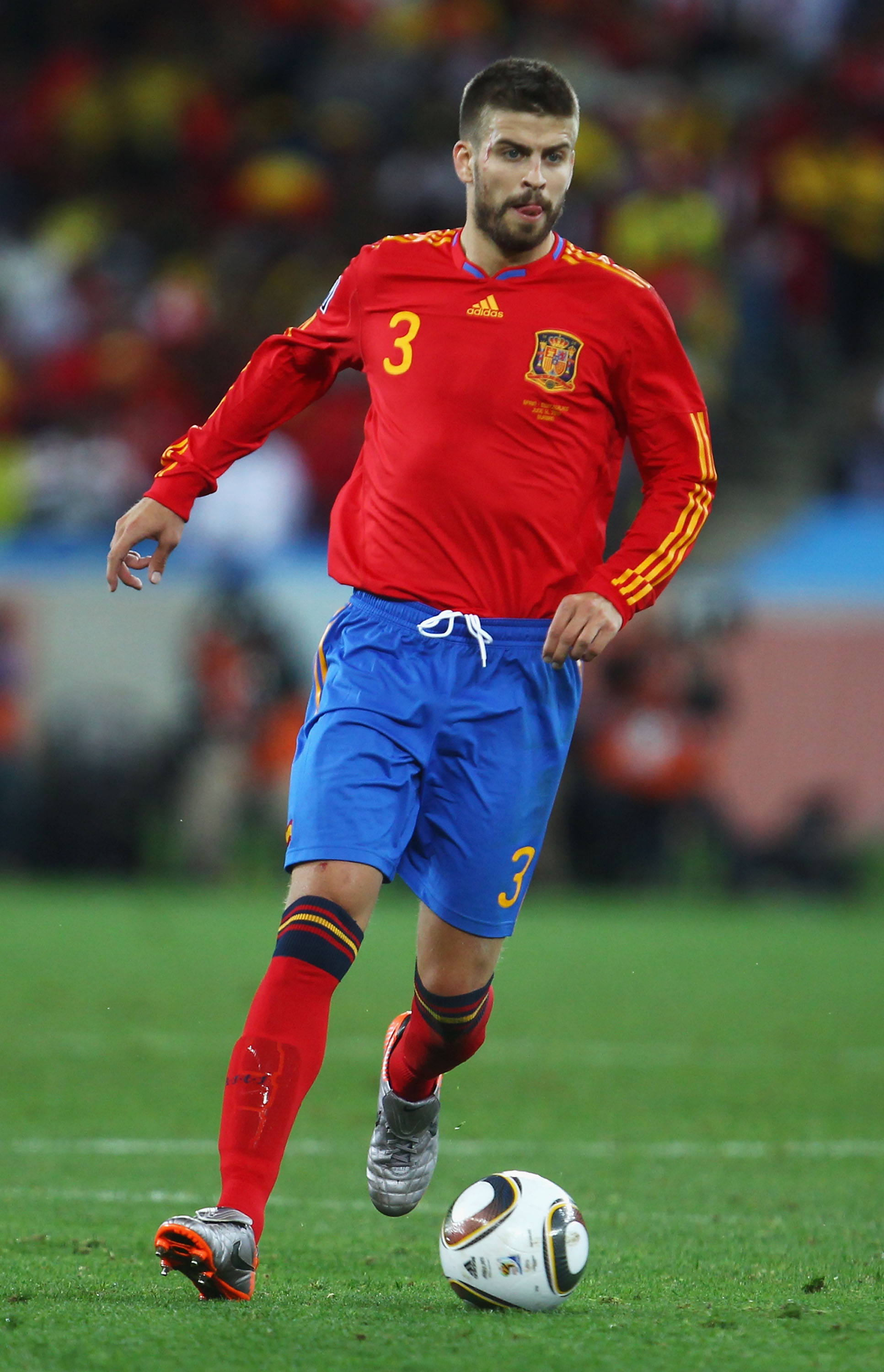 DURBAN, SOUTH AFRICA - JUNE 16:  Gerard Pique of Spain runs with the ball during the 2010 FIFA World Cup South Africa Group H match between Spain and Switzerland at Durban Stadium on June 16, 2010 in Durban, South Africa.  (Photo by Lars Baron/Getty Image