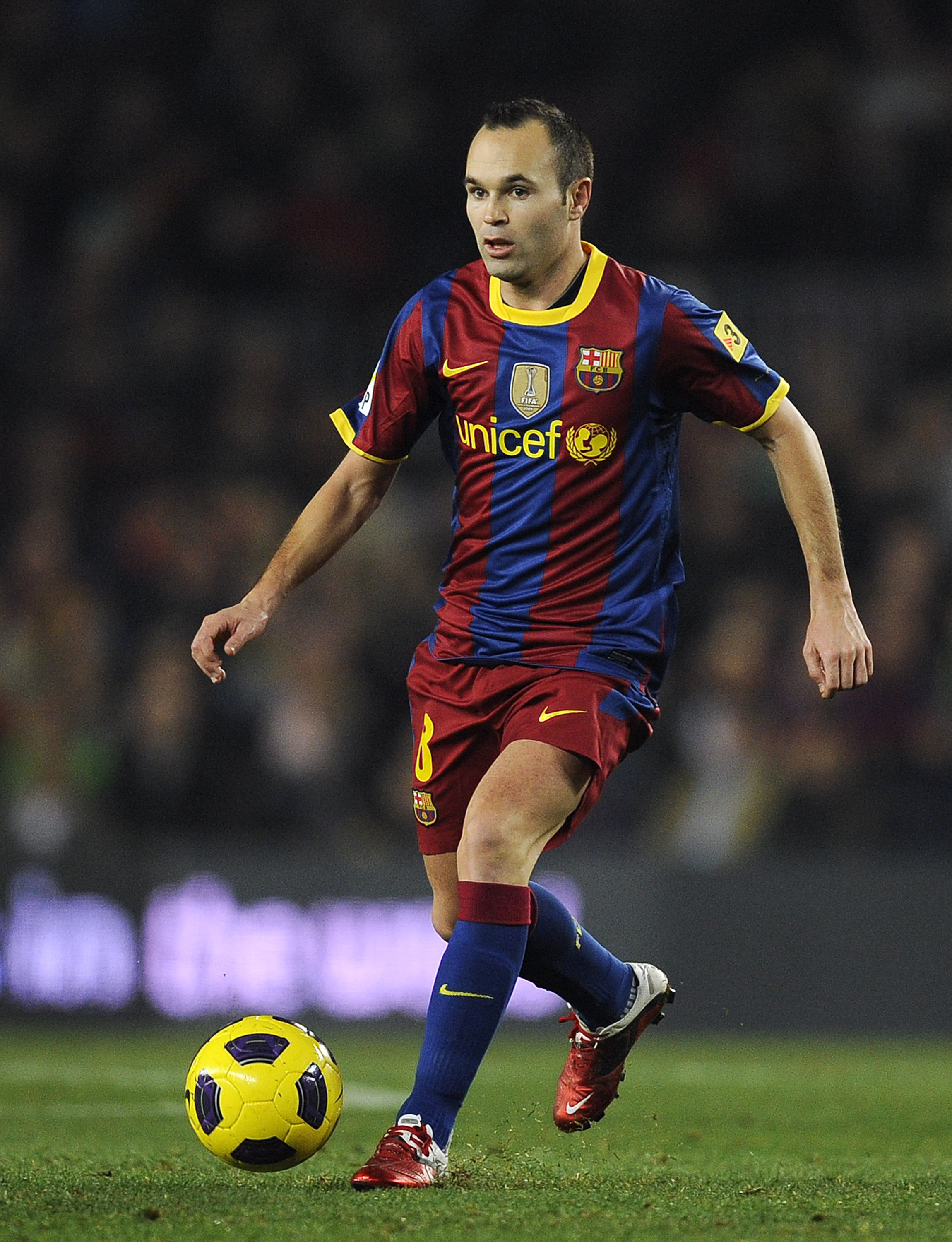 BARCELONA, SPAIN - DECEMBER 12:  Andres Iniesta of Barcelona runs with the ball during the La Liga match between Barcelona and Real Sociedad at Camp Nou Stadium on December 12, 2010 in Barcelona, Spain. Barcelona won 5-0.  (Photo by David Ramos/Getty Imag