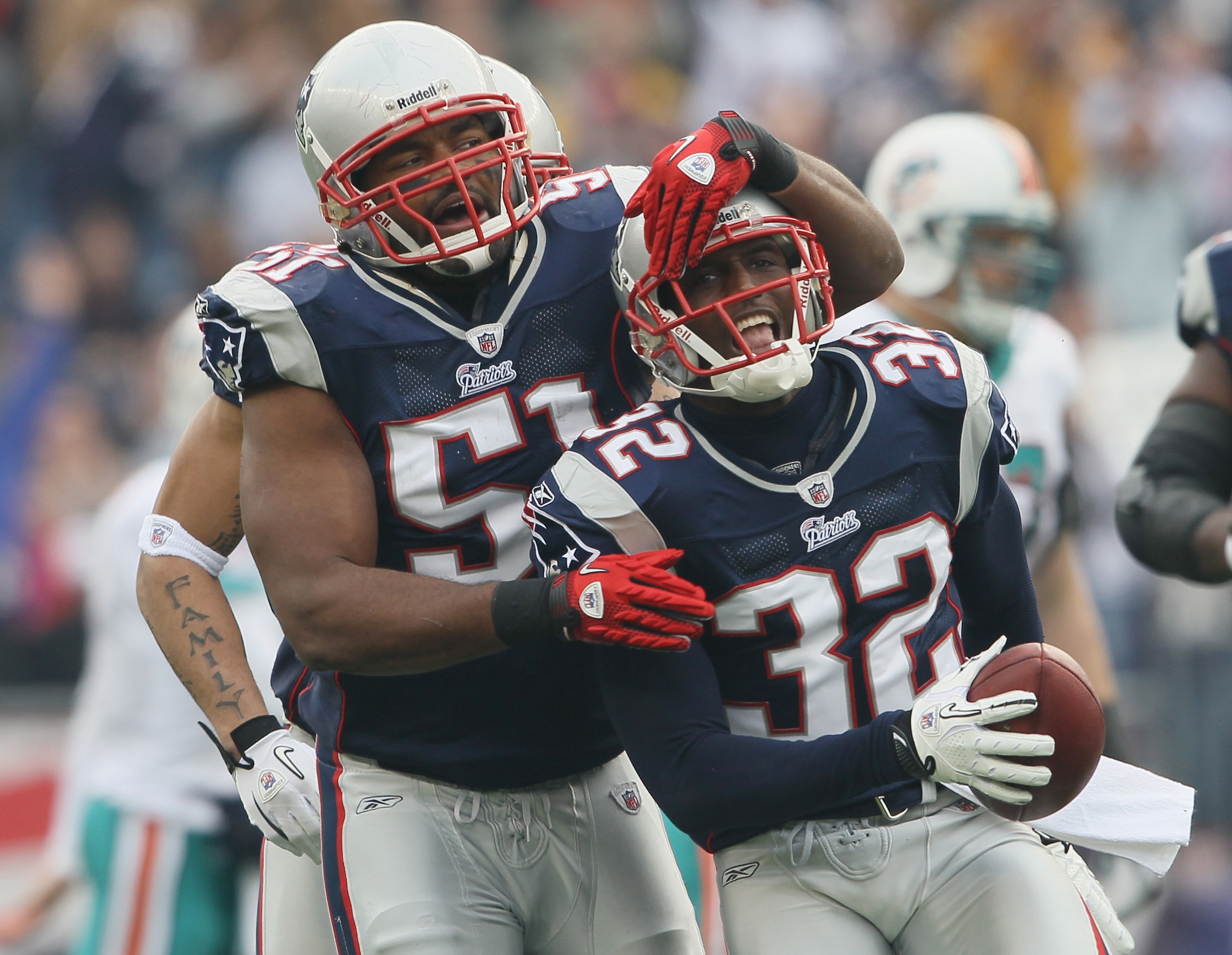 FOXBORO, MA - JANUARY 02: Devin McCourty #32 of the New England Patriots is congratulated by teammate Jerod Mayo #51 after McCourty intercepted a pass by the Miami Dolphins on January 2, 2011 at Gillette Stadium in Foxboro, Massachusetts.  (Photo by Elsa/