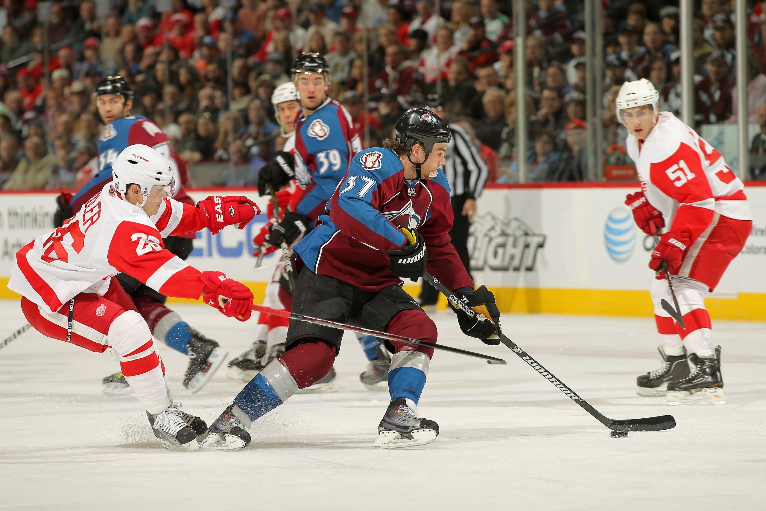 DENVER, CO - JANUARY 10:  Ryan O'Reilly #37 of the Colorado Avalanche controls the puck against Jiri Hudler #26 of the Detroit Red Wings at the Pepsi Center on January 10, 2011 in Denver, Colorado. The Avalanche defeated the Red Wings 5-4.  (Photo by Doug